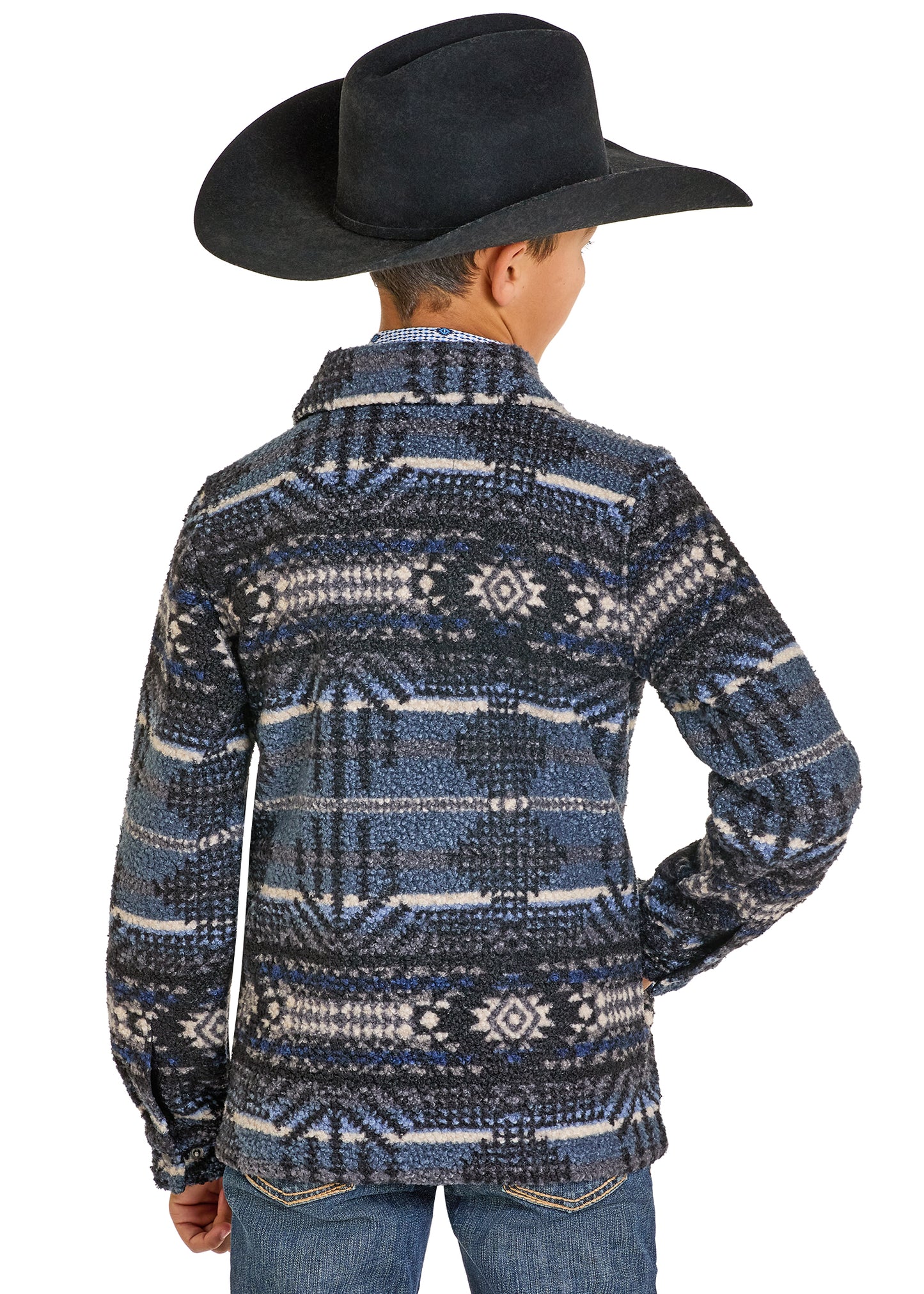 Boy wearing a patterned jacket and black cowboy hat on a white background