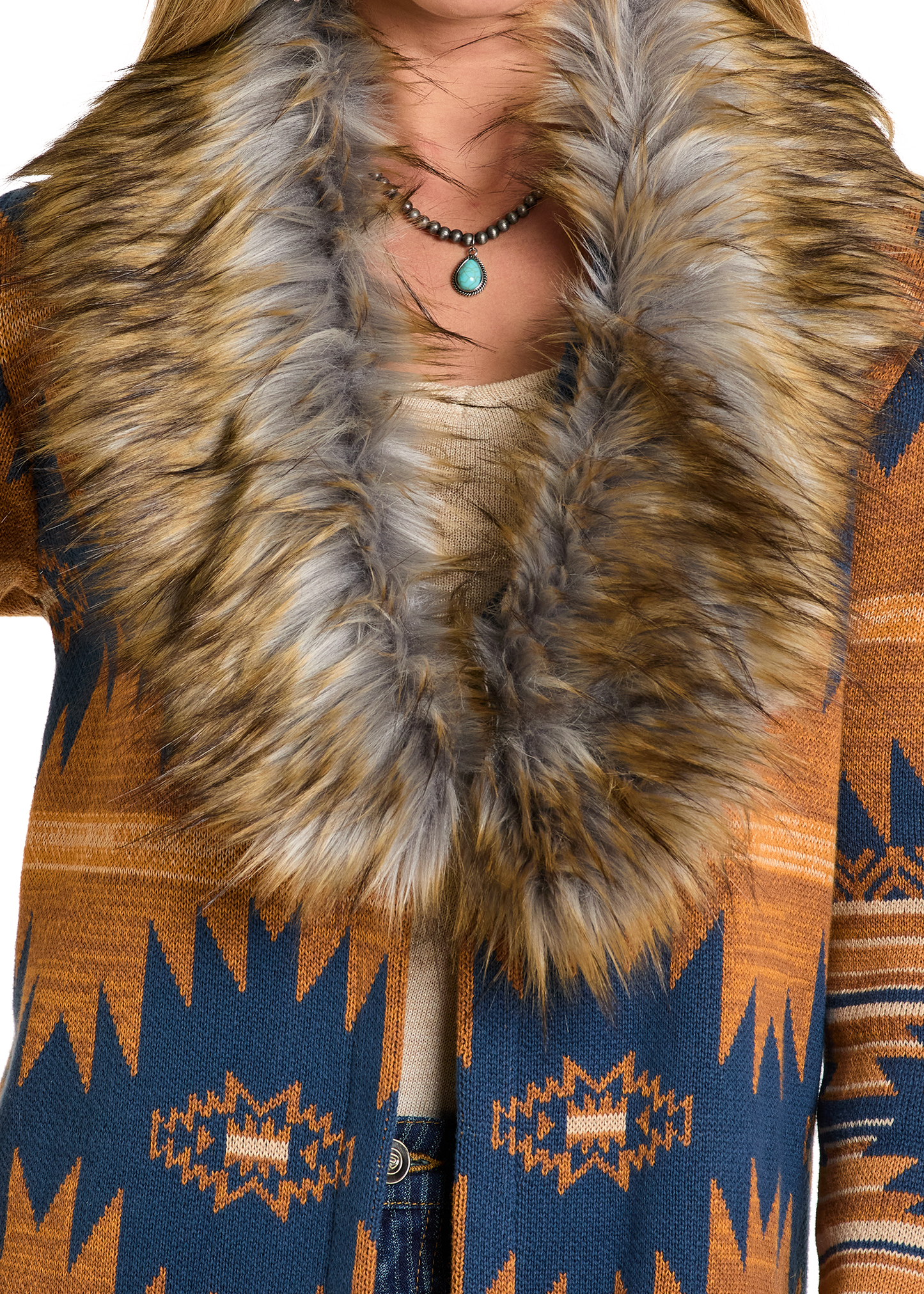 Close-up of a patterned coat with a fur collar on a white background