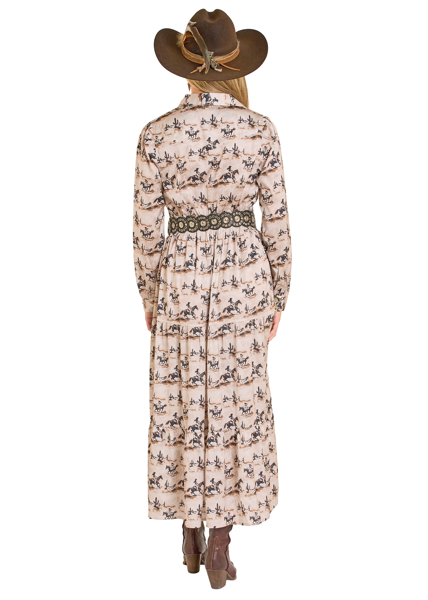 Person wearing a long, patterned dress with a belt and cowboy hat on a white background