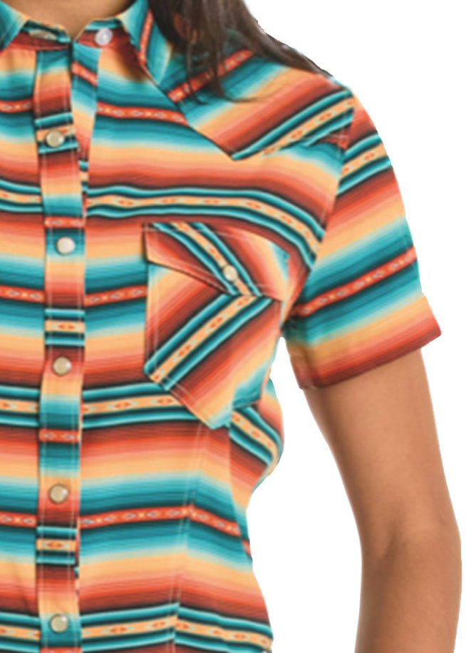 Woman wearing a colorful striped shirt and cowboy hat on a white background