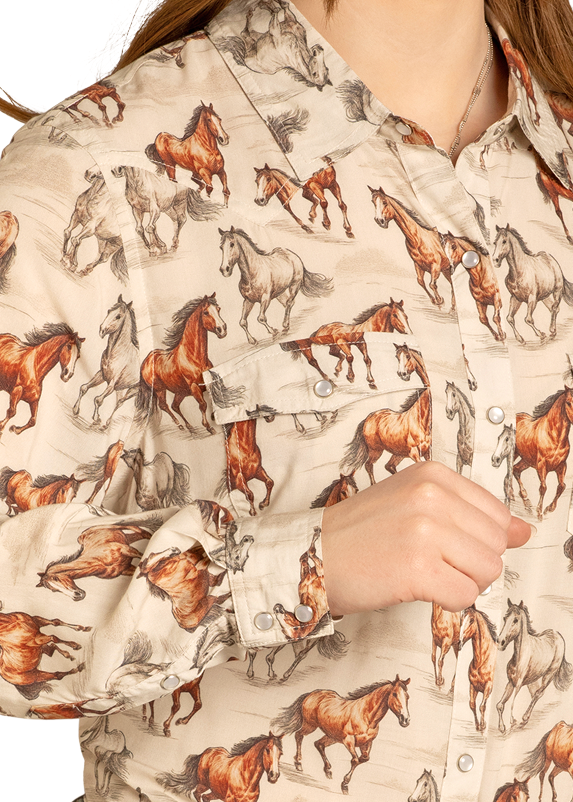 Person wearing a shirt with horse pattern and jeans