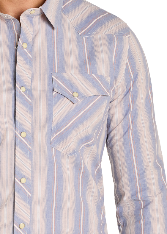 Man wearing a patterned shirt and jeans on a white background