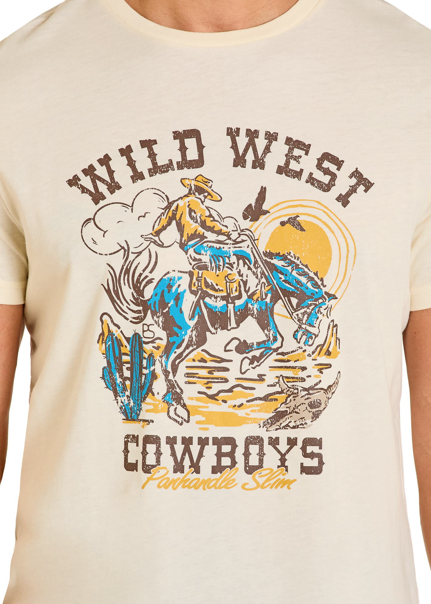 Beige t-shirt with a graphic of a cowboy riding a horse and 'Wild West Cowboys' text.