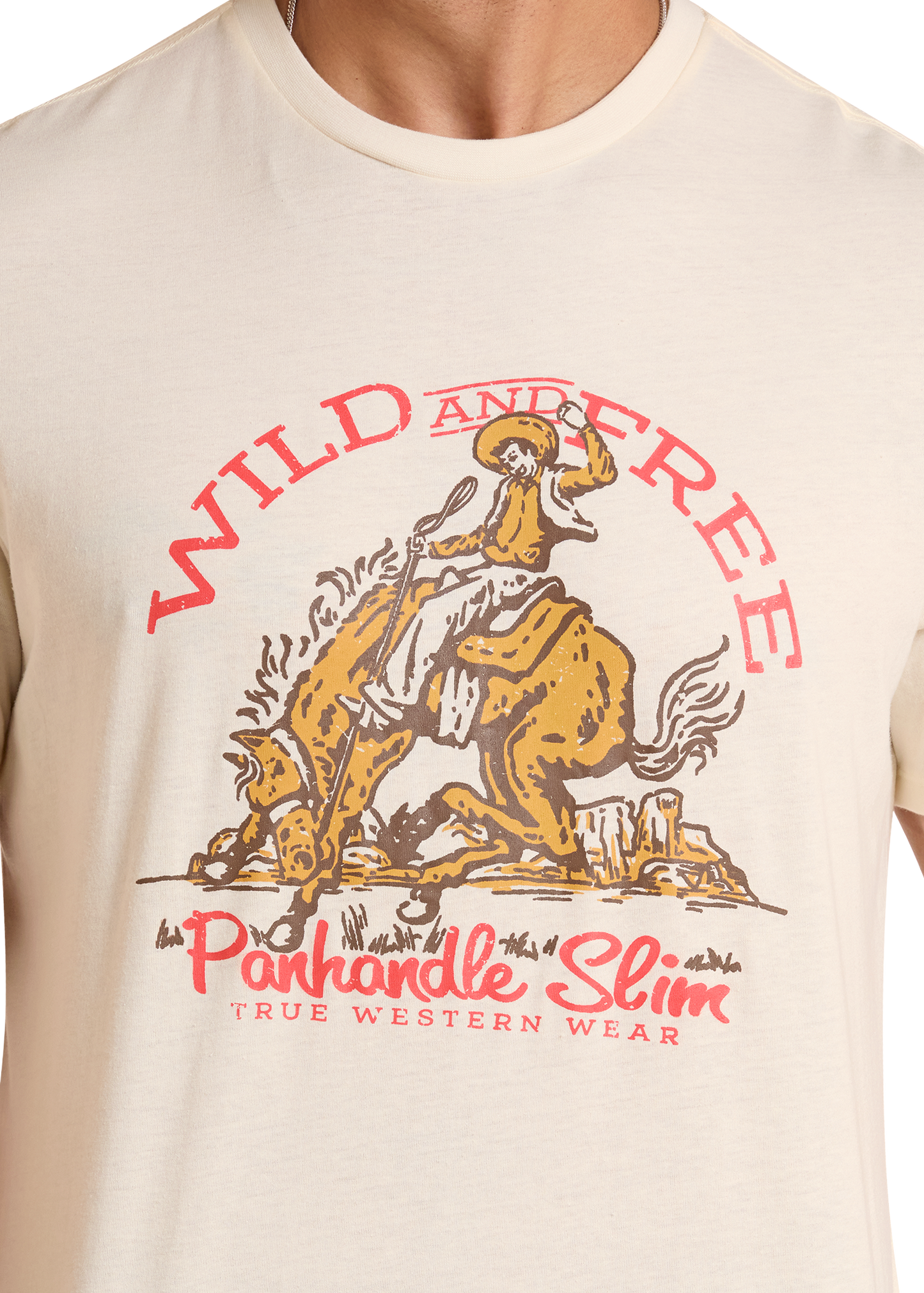 Beige t-shirt with a graphic of a cowboy on a horse and 'Wild and Free' text, featuring the Panhandle Slim brand.
