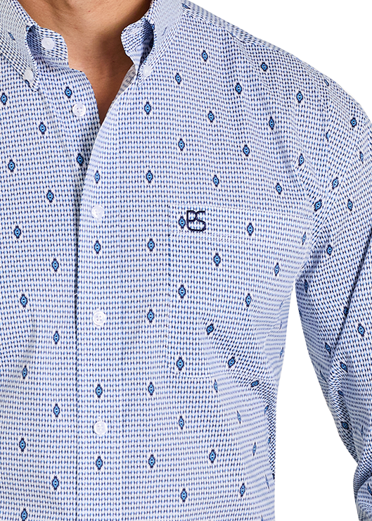 Man wearing a blue patterned shirt, black cowboy hat, and jeans on a white background