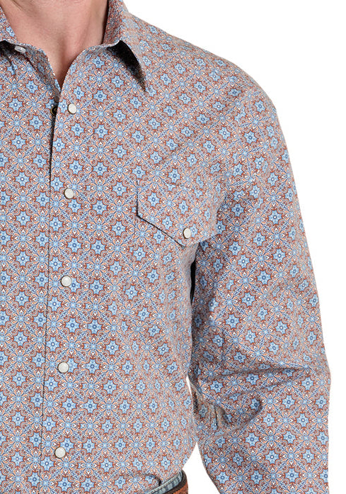 Man wearing a patterned shirt, jeans, and a cowboy hat on a white background