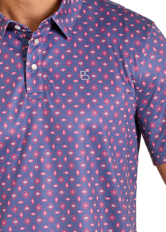 Close-up of a person wearing a patterned polo shirt with a visible brand logo.