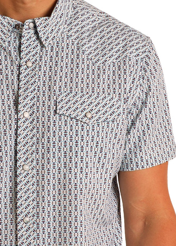 Man wearing a patterned shirt and cowboy hat on a white background