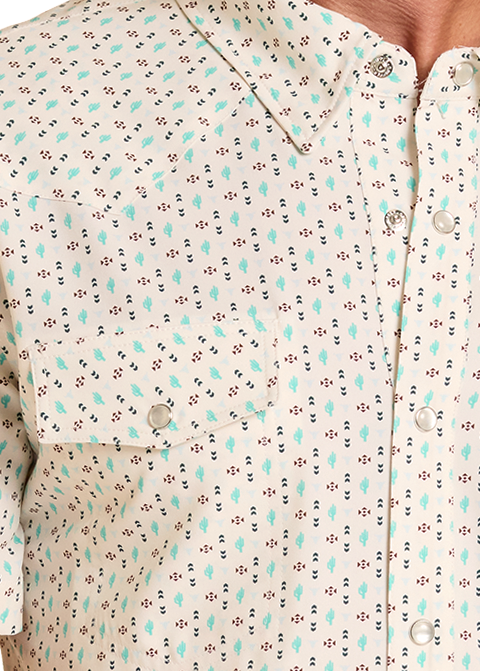 Man wearing a patterned short-sleeve shirt, jeans, and a cowboy hat on a white background