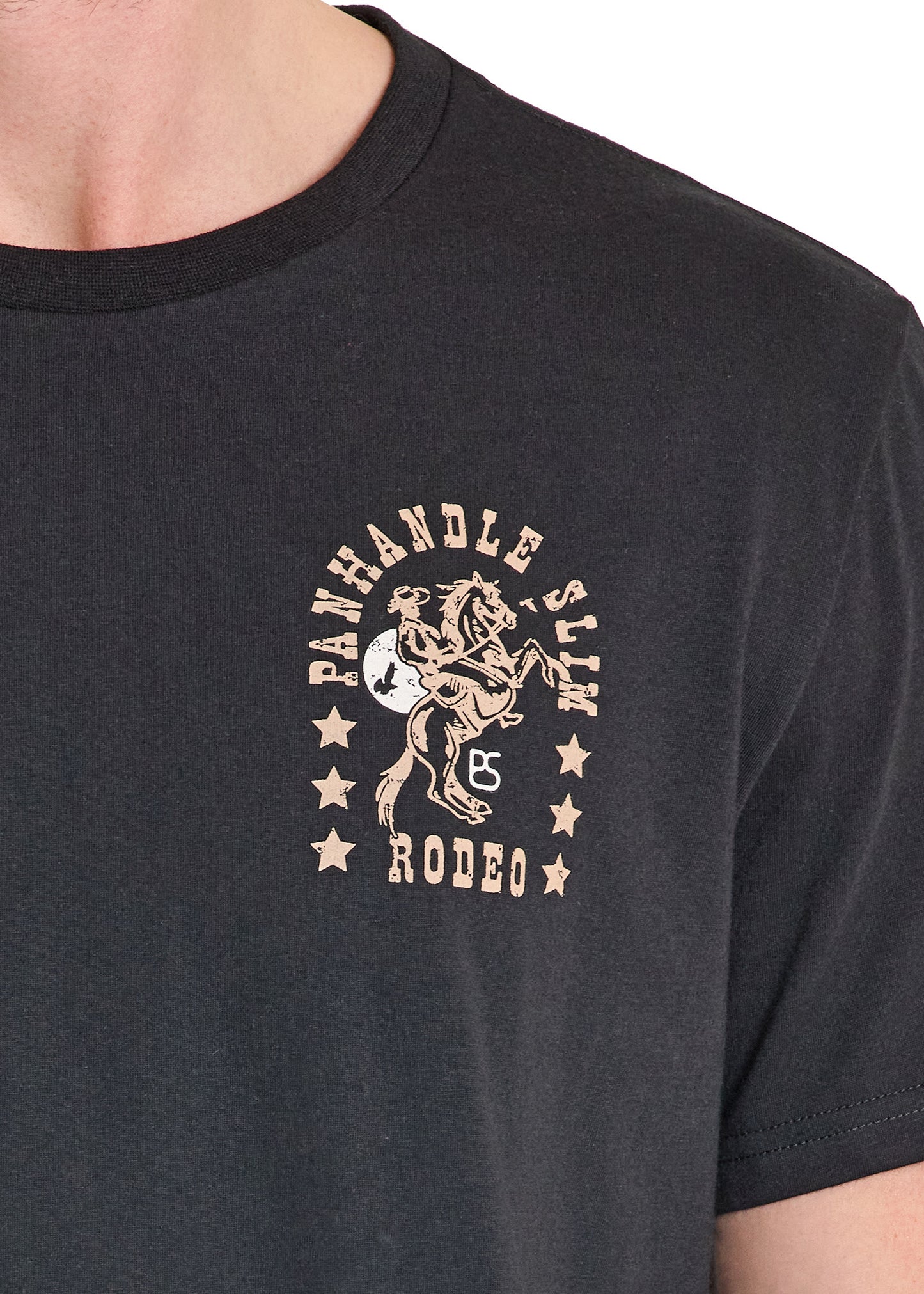 Black t-shirt with 'Panhandle Slim Rodeo' graphic design on a plain background