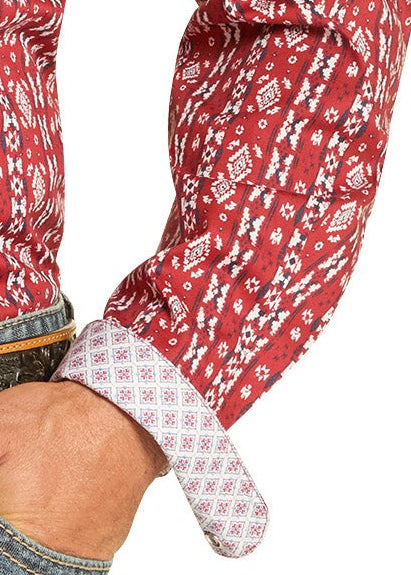 Man wearing a red patterned shirt and jeans on a white background