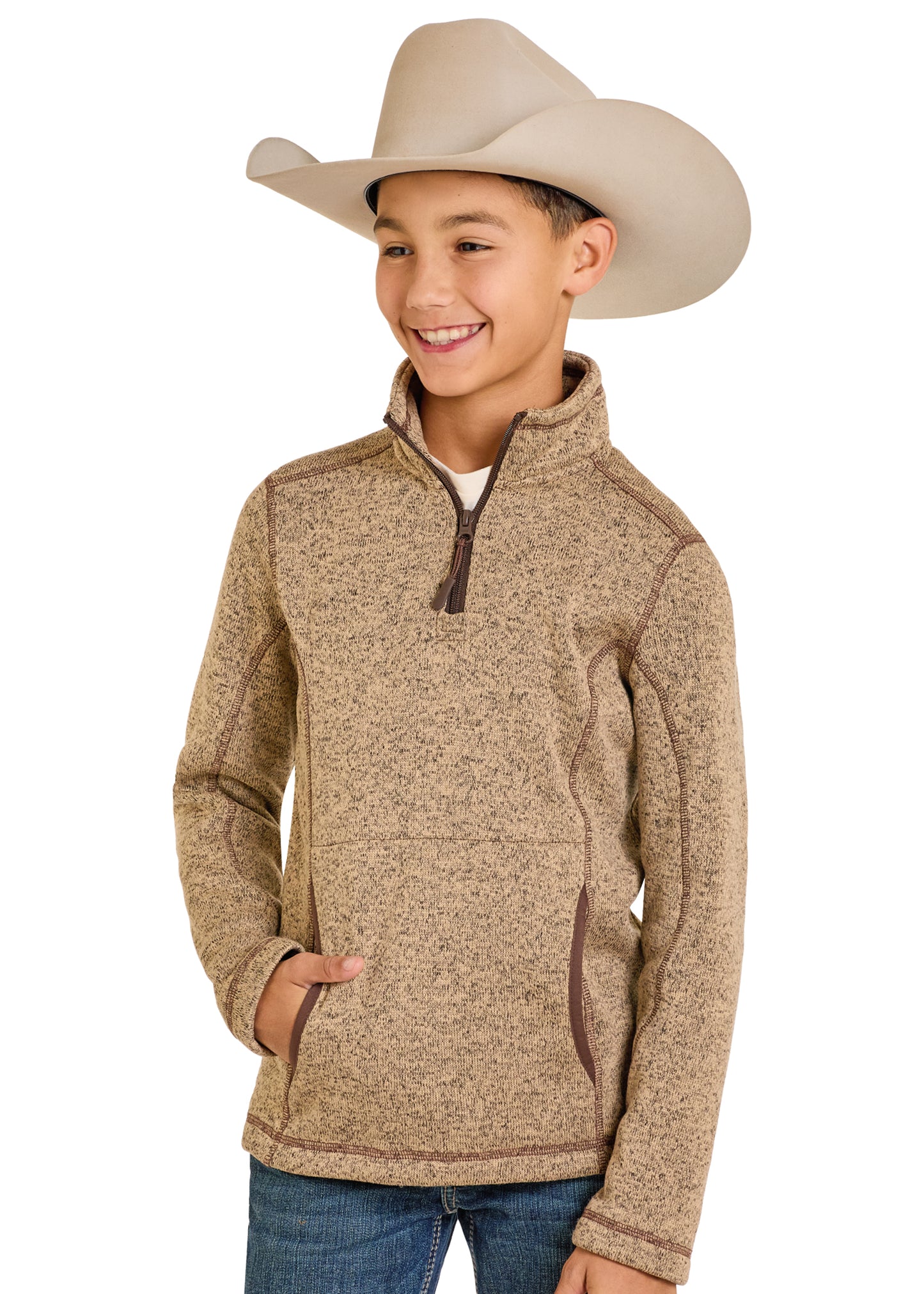 Child wearing a beige sweater and cowboy hat on a white background
