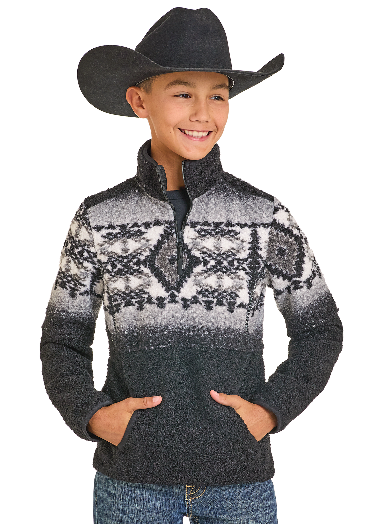 Child wearing a patterned sweater and cowboy hat on a white background
