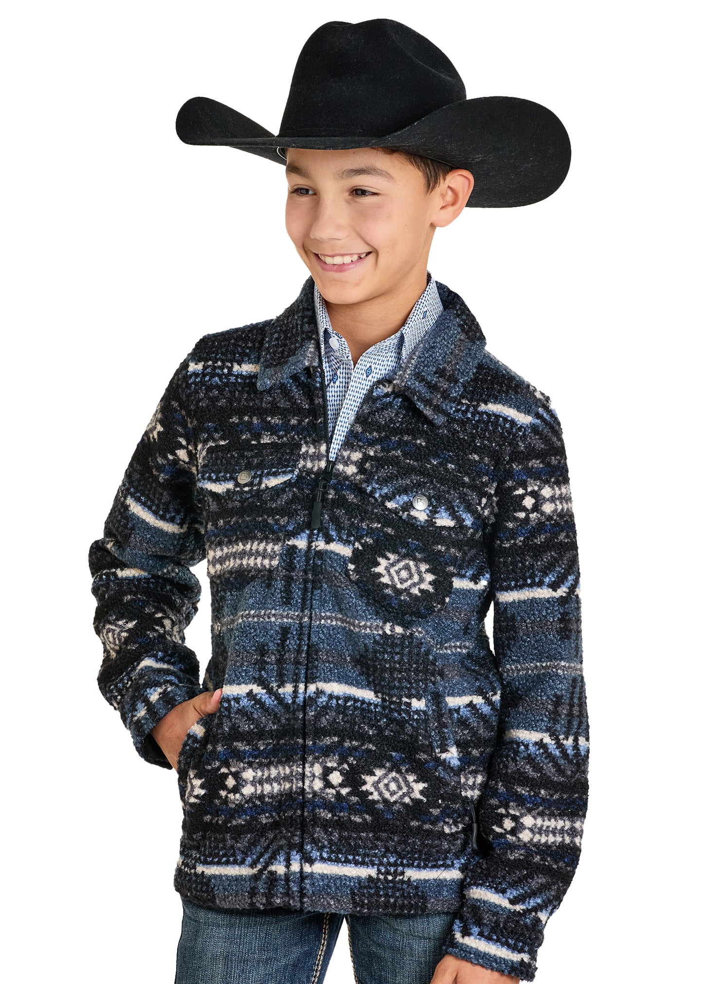 Child wearing a patterned jacket and cowboy hat on a white background