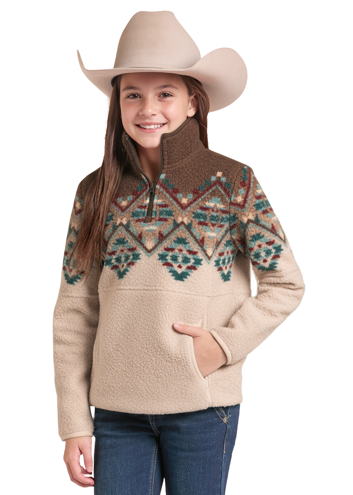 A young girl wearing a beige fleece pullover sweater with a brown yoke and a colorful geometric pattern across the chest, paired with a beige cowboy hat and blue jeans.