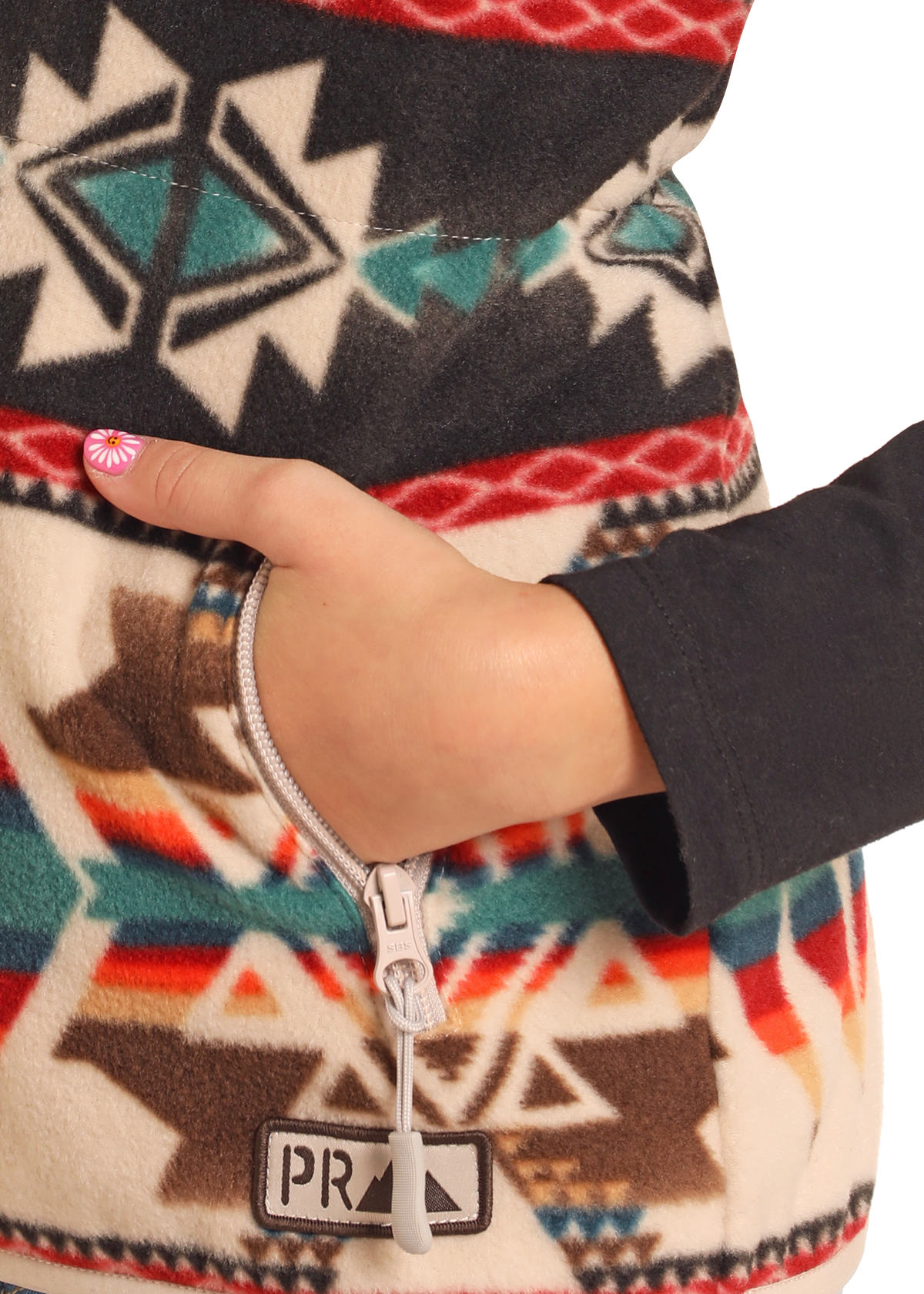 detail image of an Aztec fleece vest pocket. 