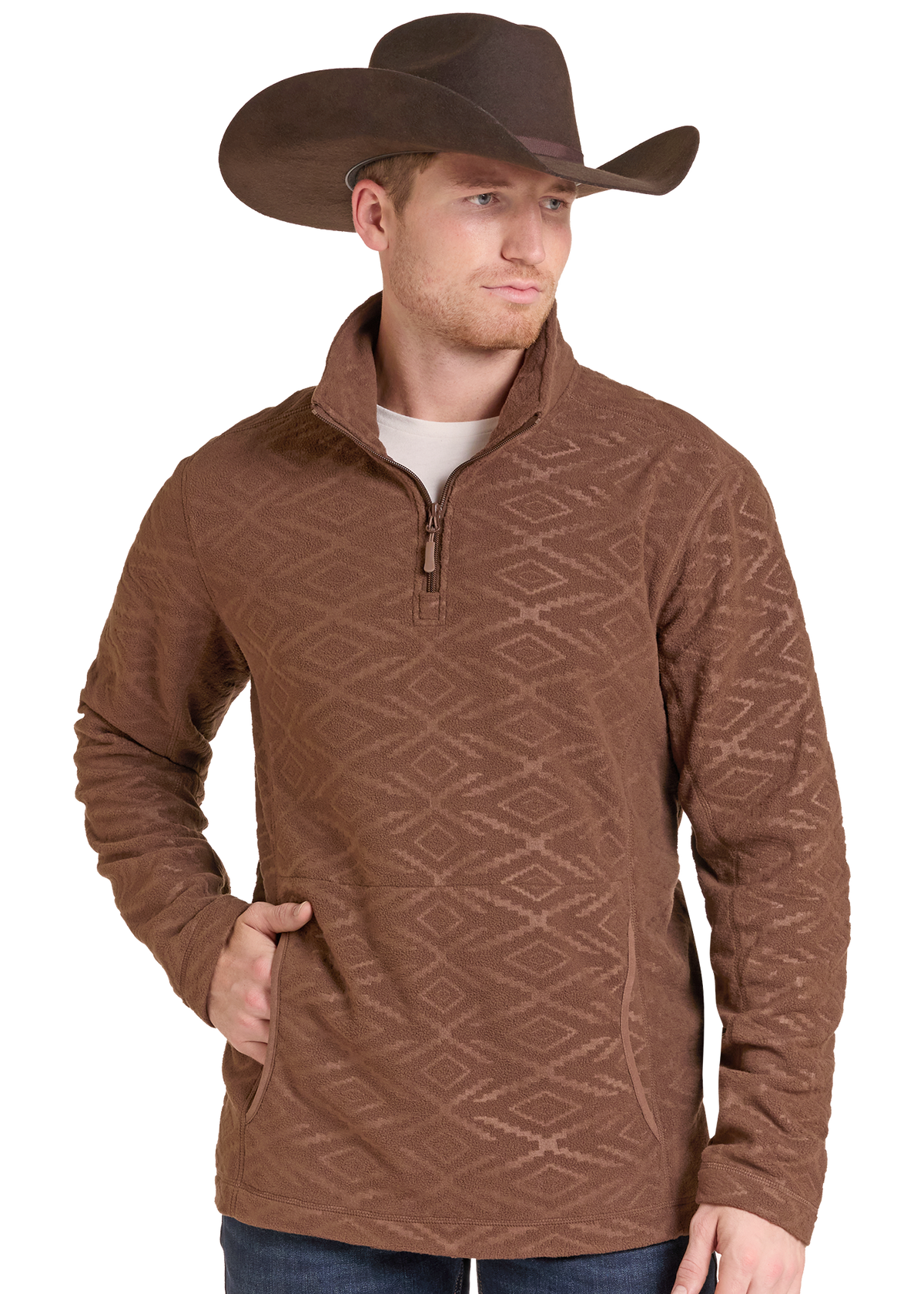 A man wearing a brown quarter-zip fleece pullover with a subtle geometric diamond pattern, paired with a brown cowboy hat and blue jeans.