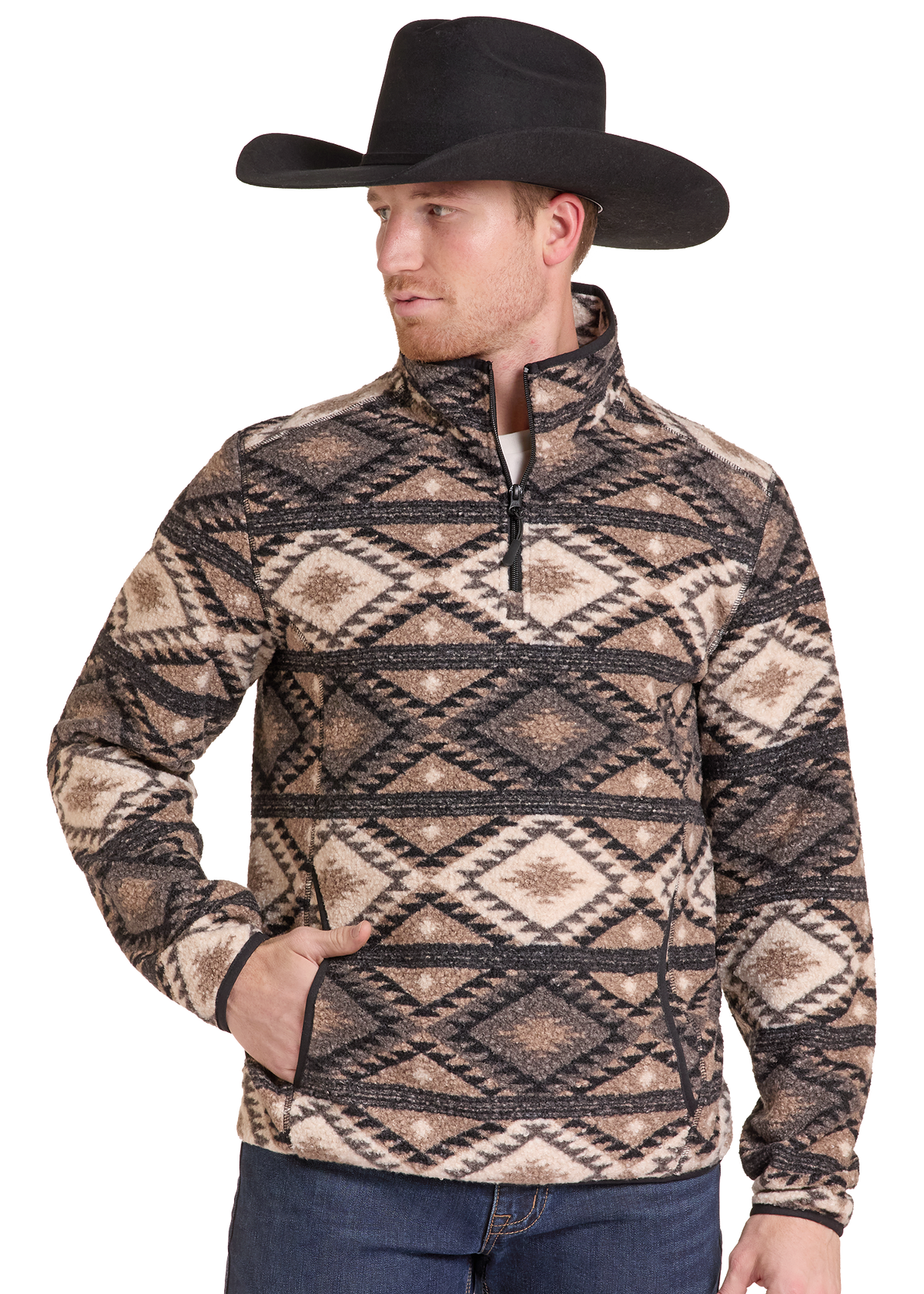 A man wearing a black cowboy hat and a quarter-zip fleece pullover with a brown, beige, and black geometric pattern, paired with blue jeans, set against a plain white background.