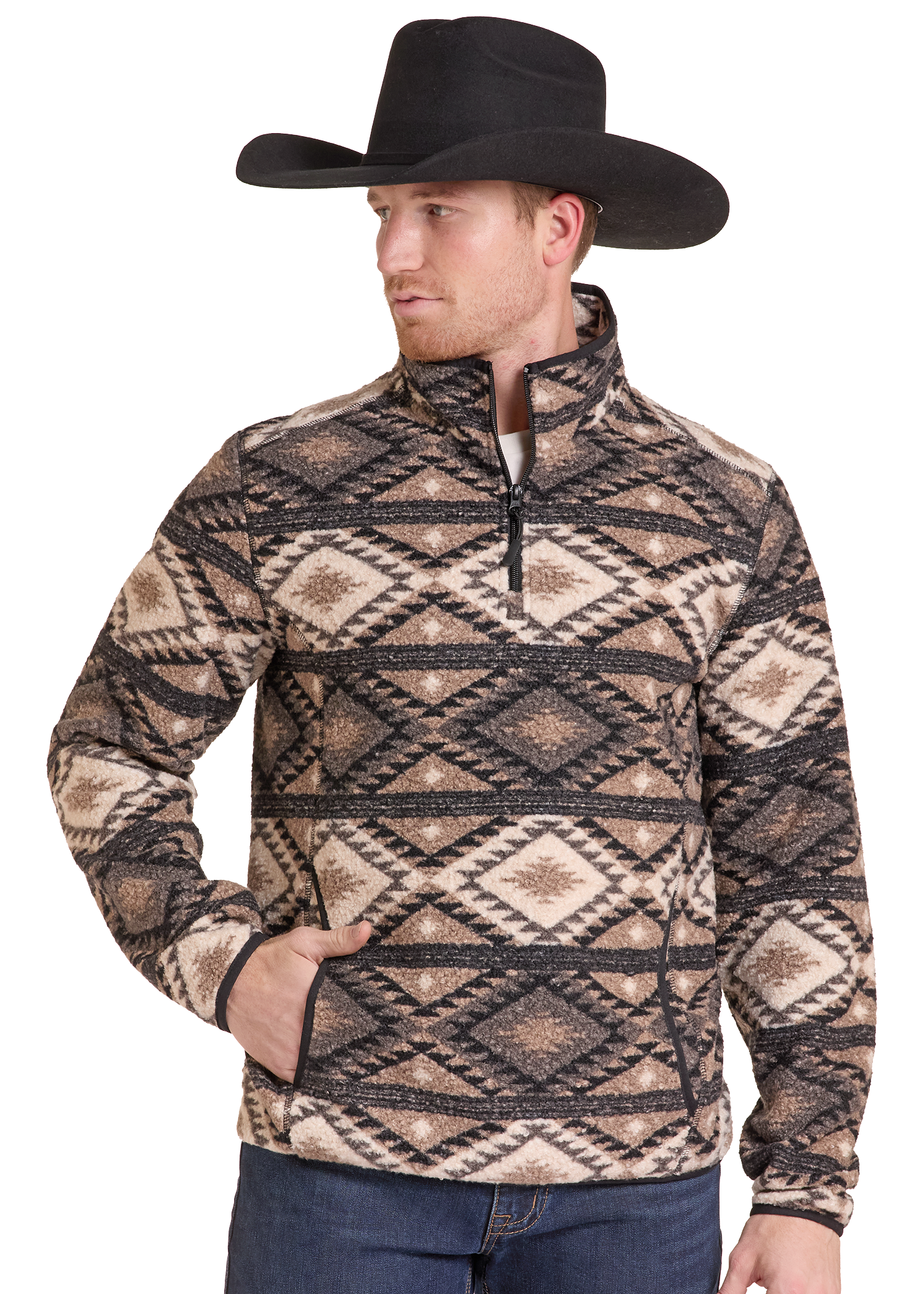 A man wearing a black cowboy hat and a quarter-zip fleece pullover with a brown, beige, and black geometric pattern, paired with blue jeans, set against a plain white background.