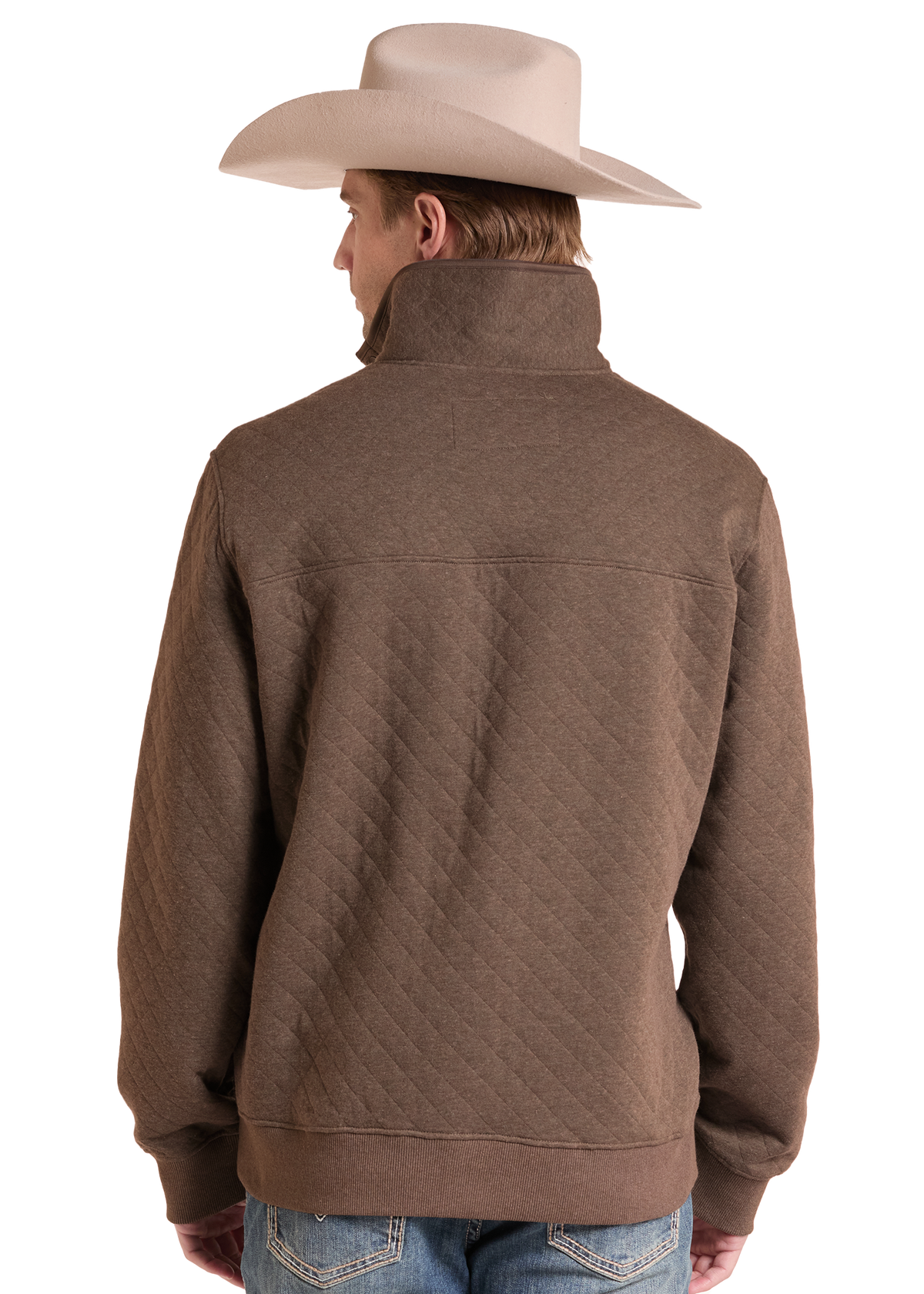 A man shown from the back wearing a brown quilted quarter-zip pullover jacket, a light beige cowboy hat, and blue jeans against a white studio background.