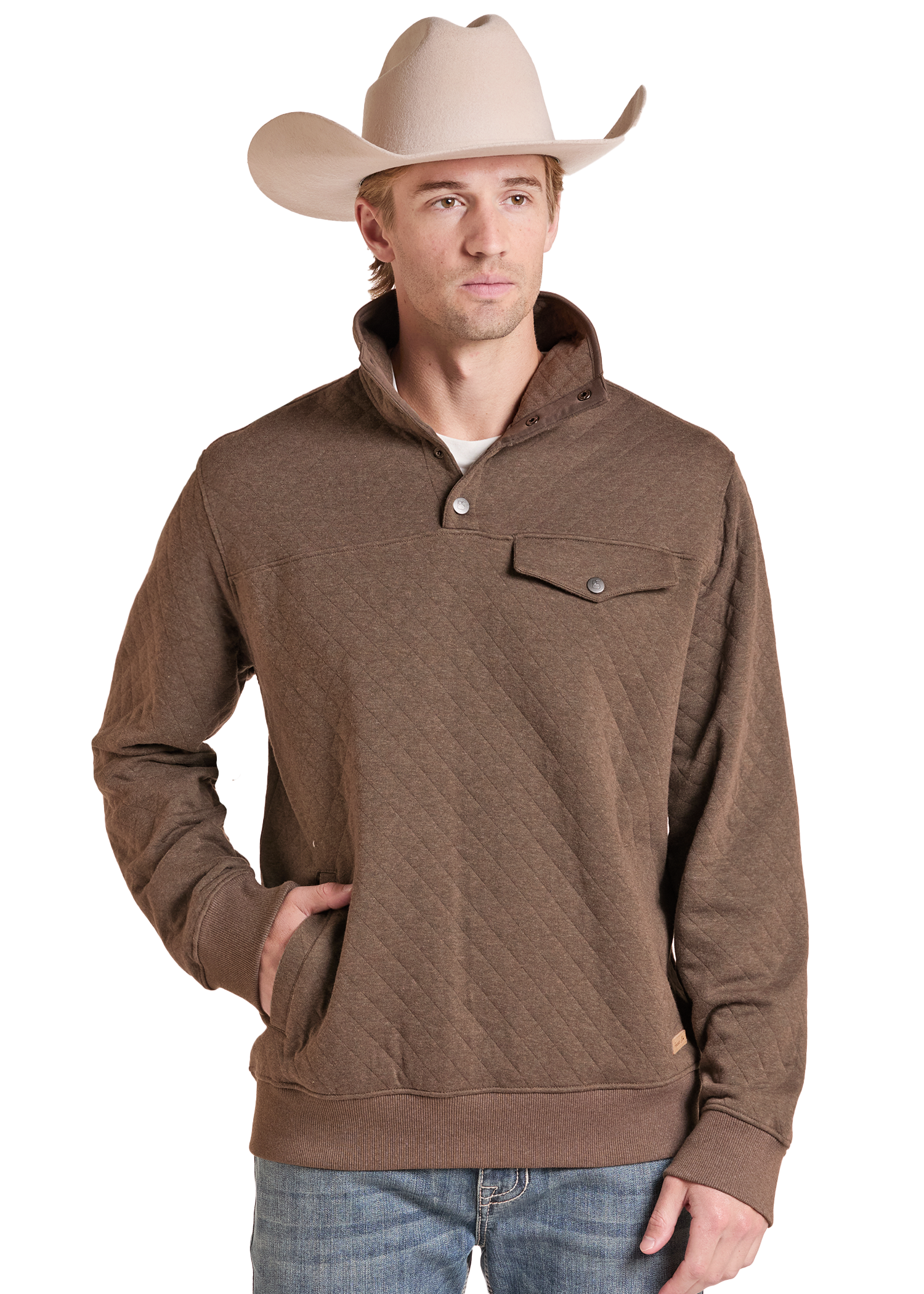 A man wearing a brown quilted long-sleeve pullover sweater with a stand collar and chest pocket, paired with a beige cowboy hat and blue jeans.