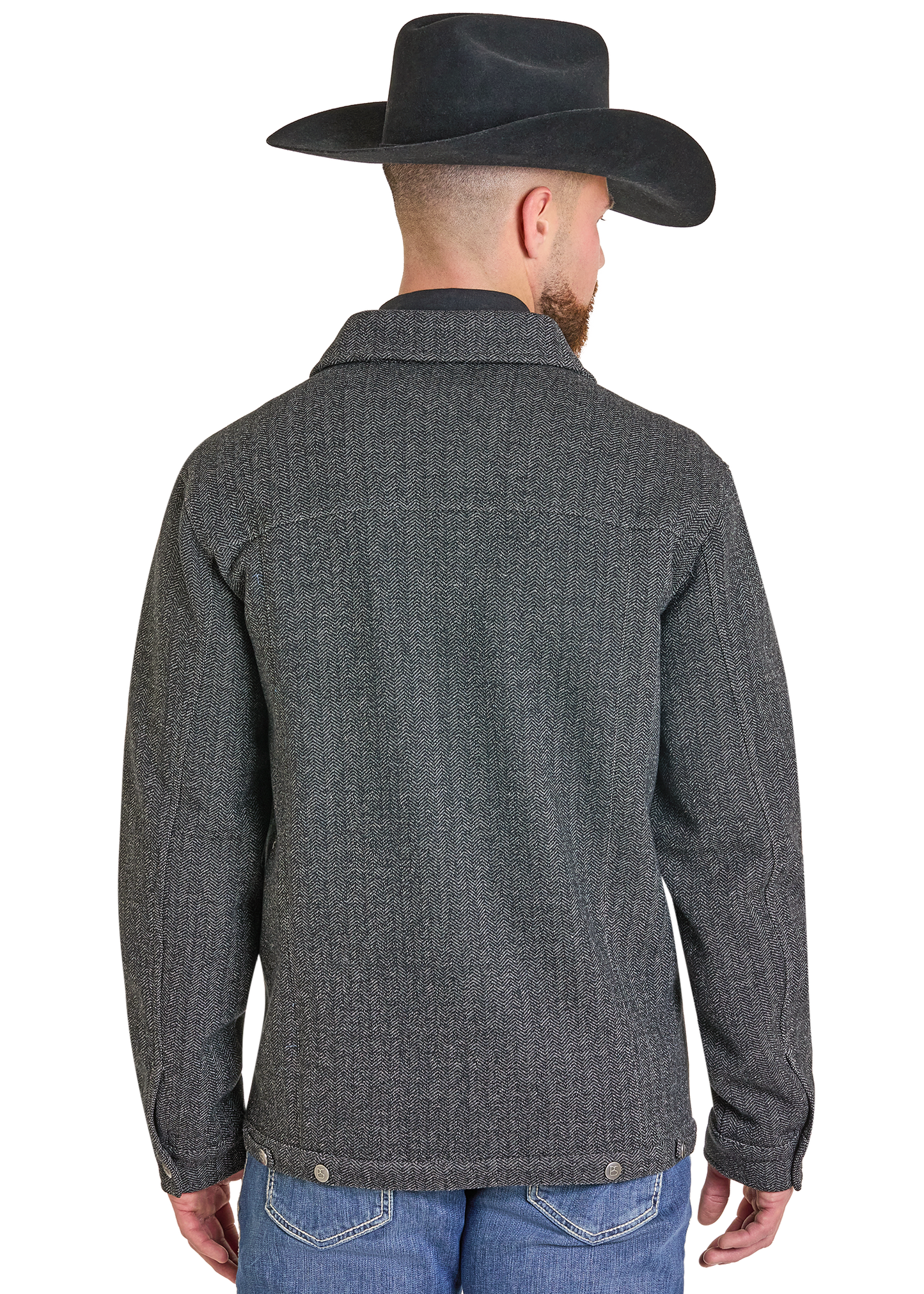 A man viewed from the back wearing a dark gray textured button-up jacket, a black cowboy hat, and blue jeans against a plain white background.