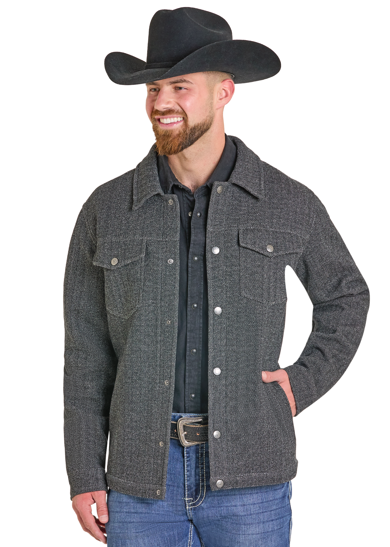 A man wearing a dark gray textured western-style jacket over a black shirt, blue jeans, and a black cowboy hat.