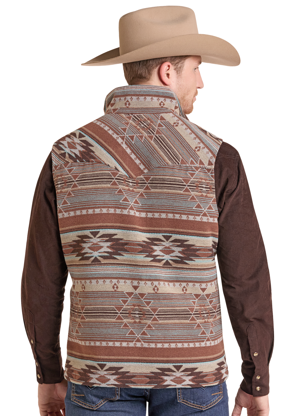 A man shown from the back wearing a brown and beige patterned western vest over a dark brown long-sleeve shirt, paired with a tan cowboy hat and blue jeans.