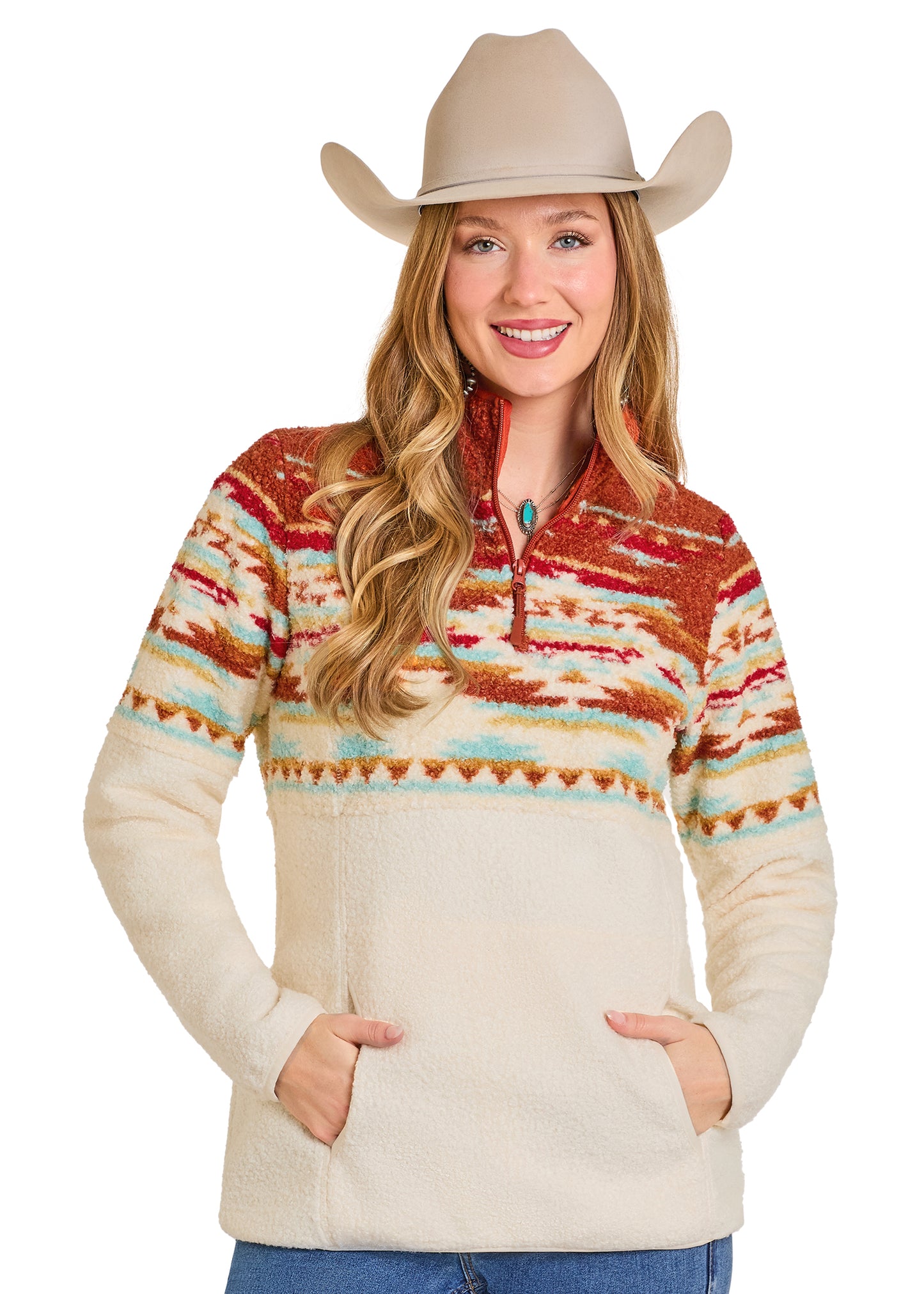 Woman wearing a patterned pullover with a cowboy hat on a white background