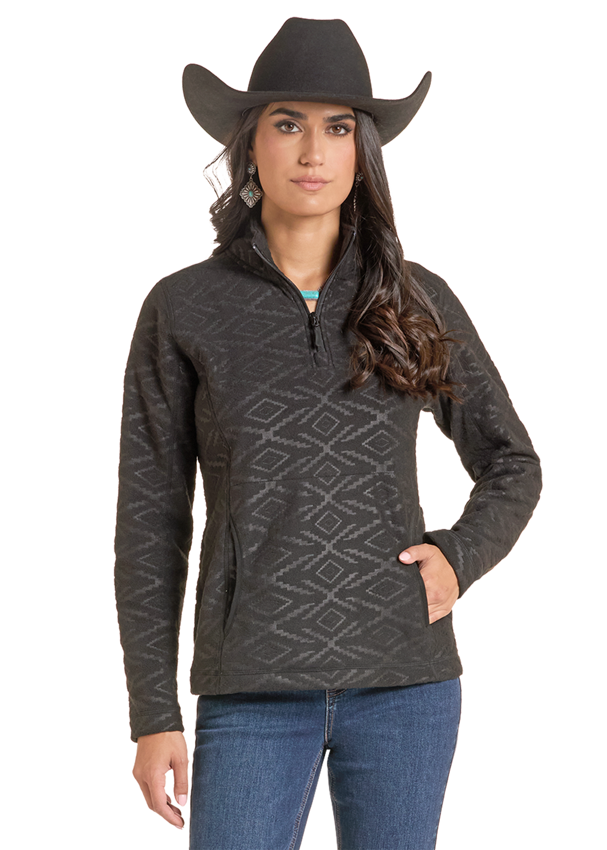 A woman modeling a dark charcoal gray quarter-zip fleece pullover with a subtle geometric diamond pattern, paired with a black cowboy hat and blue jeans.