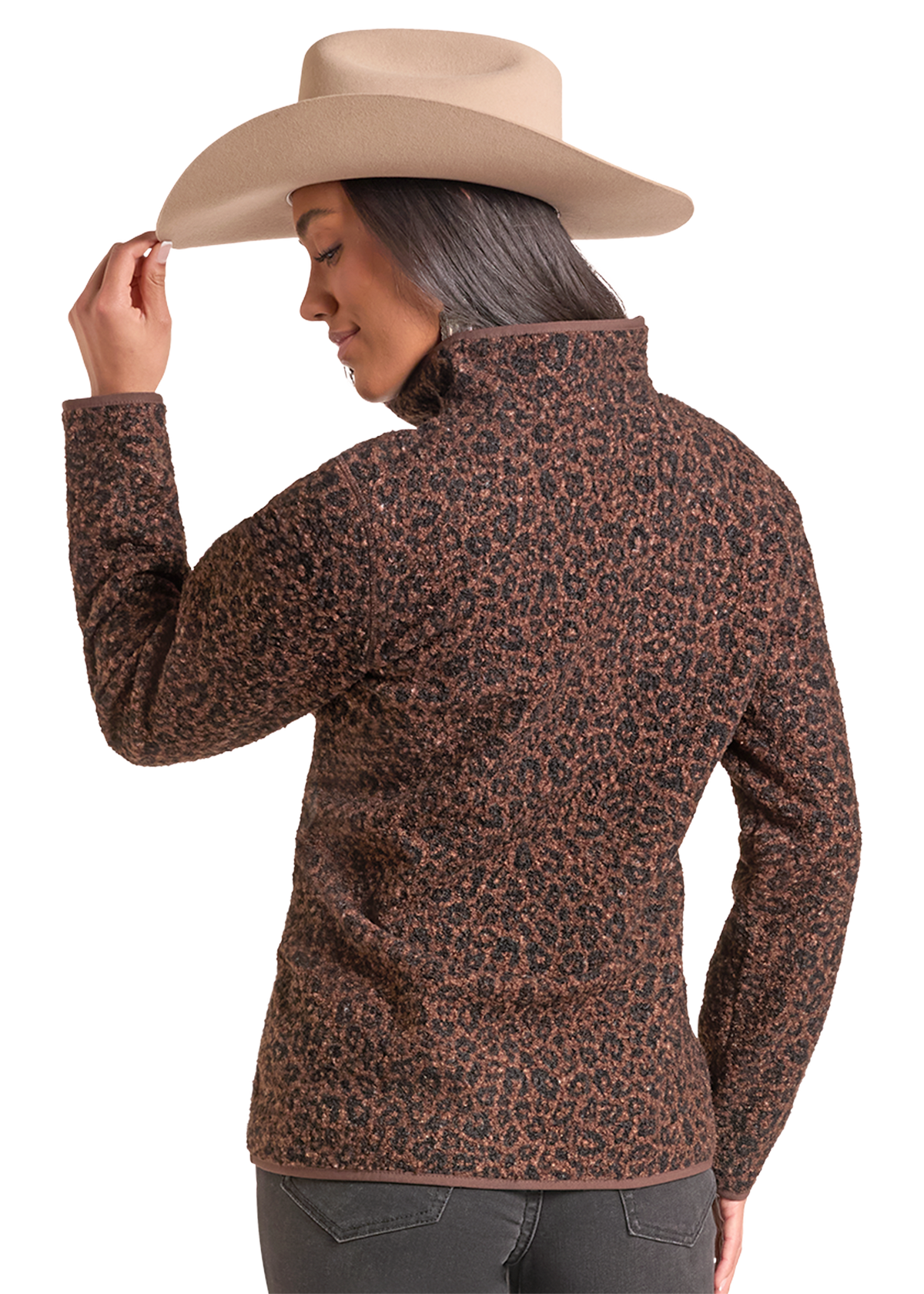 A woman wearing a brown and black leopard-print fleece jacket and a beige cowboy hat, shown from a three-quarters back view.