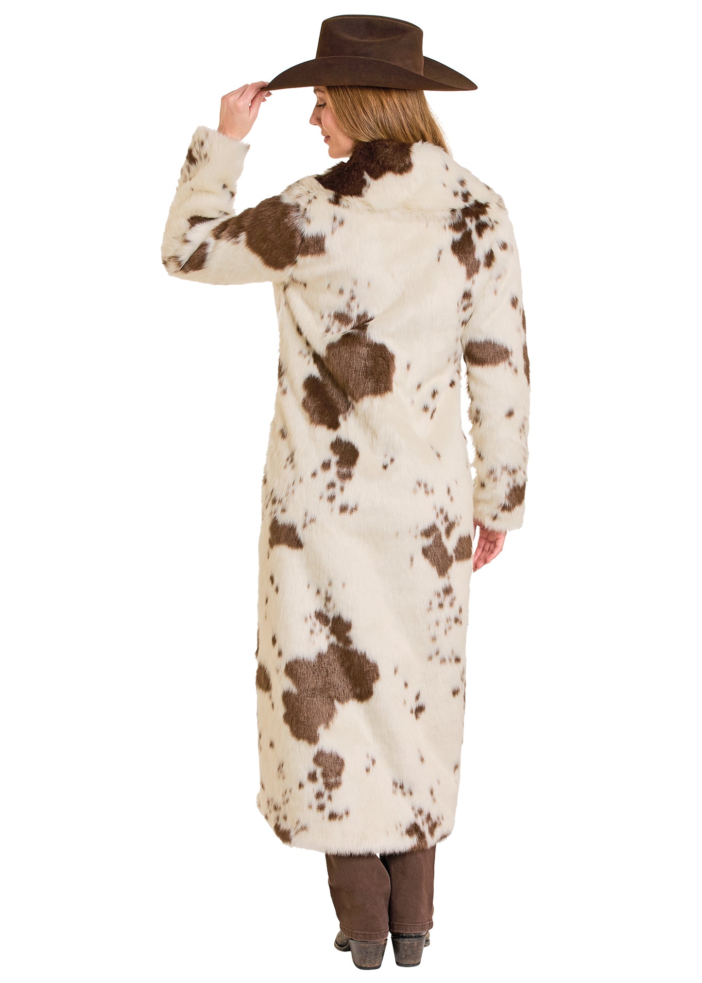Person wearing a long cowhide coat with a brown hat on a white background
