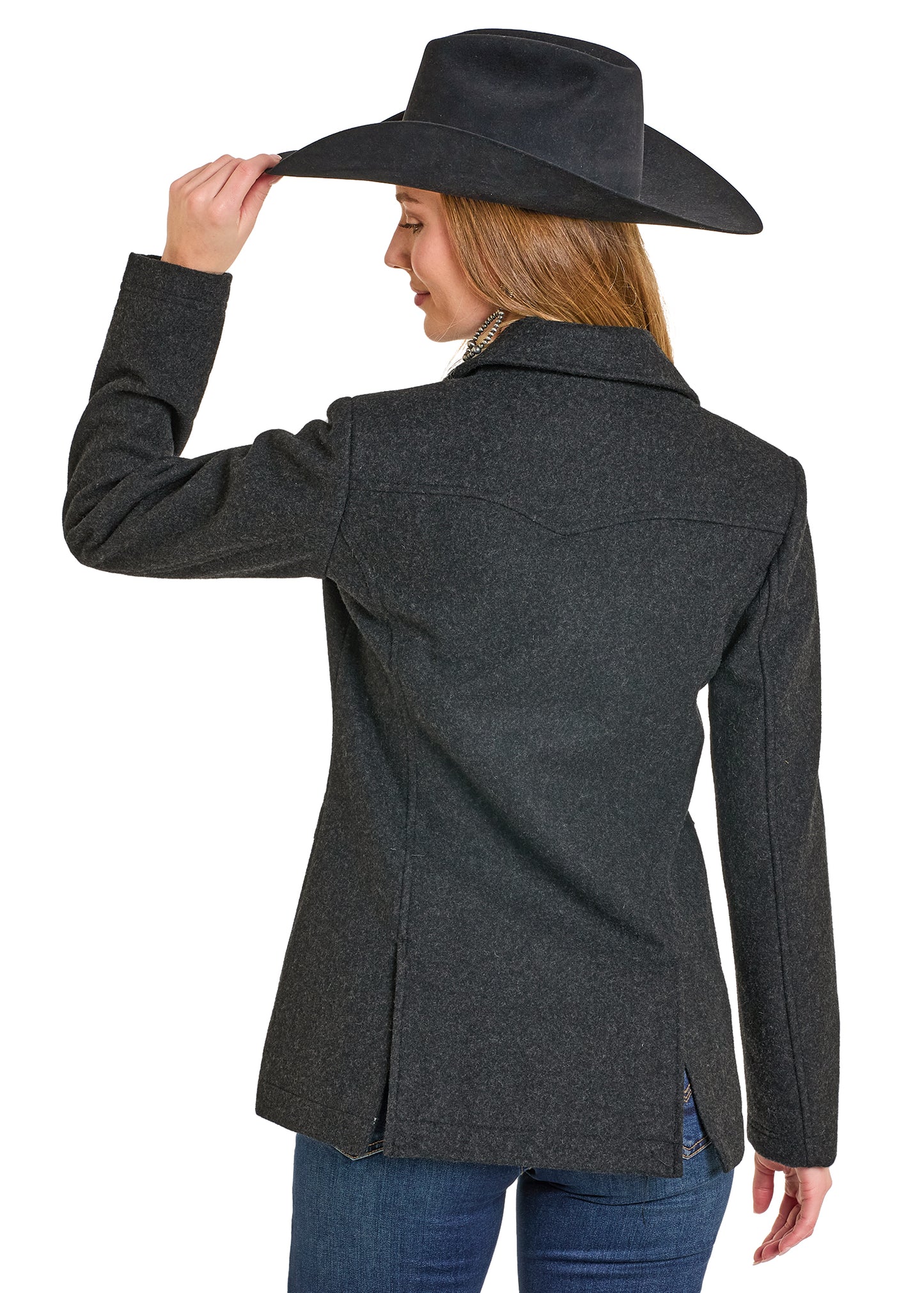 Woman wearing a gray jacket and black cowboy hat on a white background