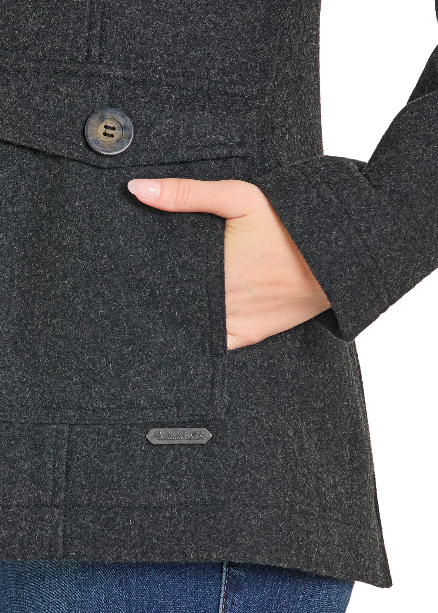 Dark gray coat with a button and visible brand label, worn over jeans.