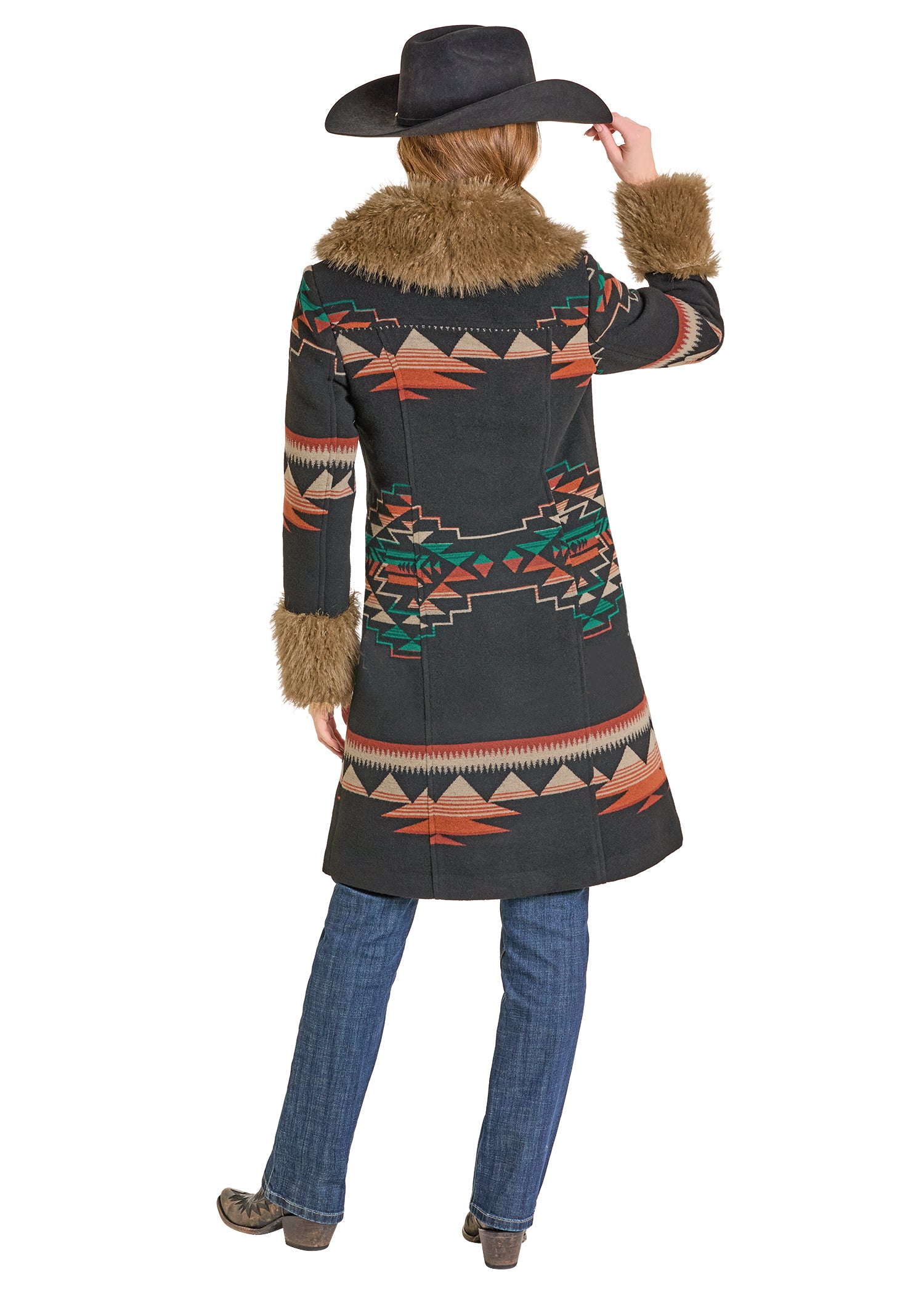 Person wearing a patterned coat with fur trim and a cowboy hat on a white background
