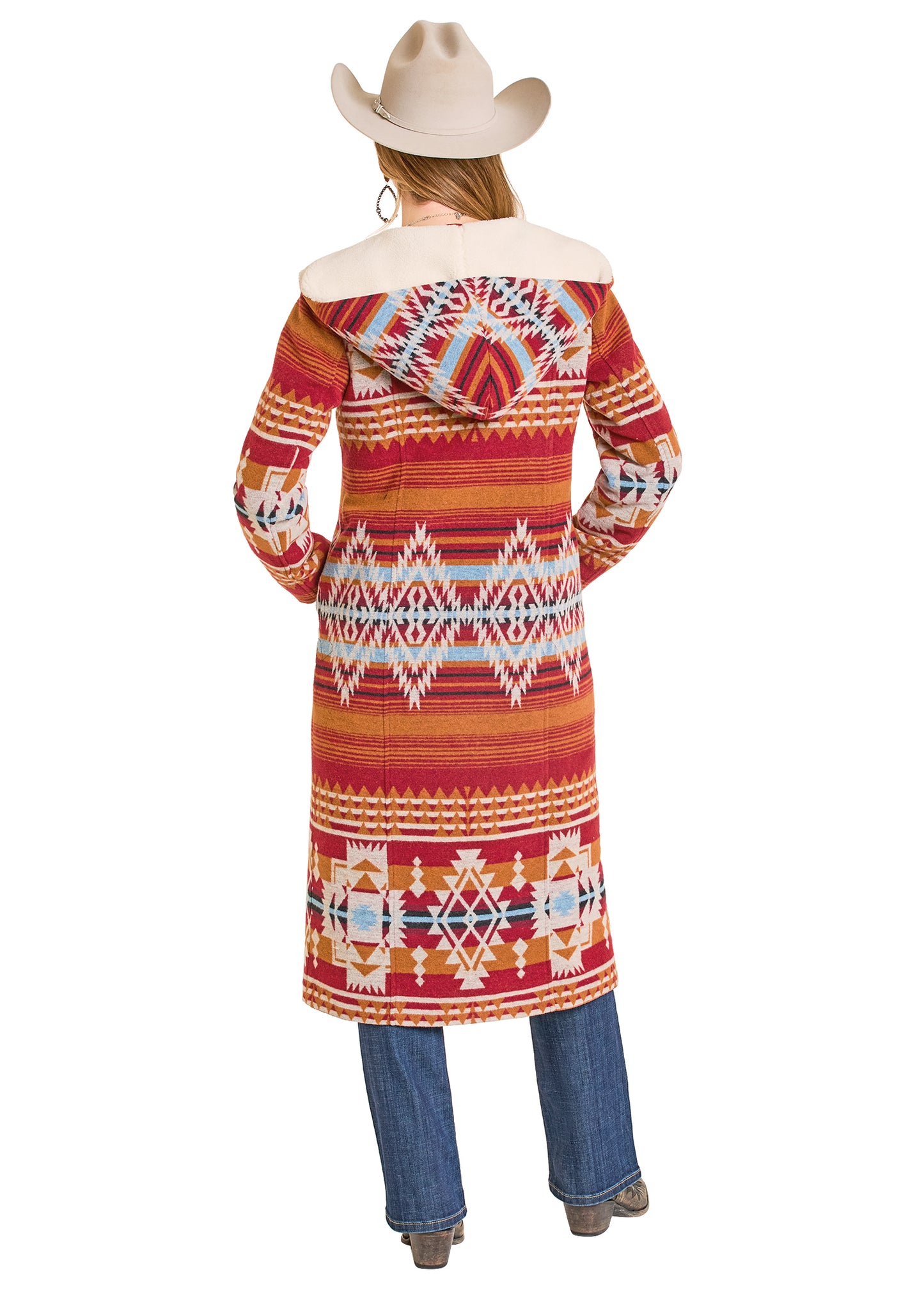 Person wearing a colorful patterned coat with a hood on a white background