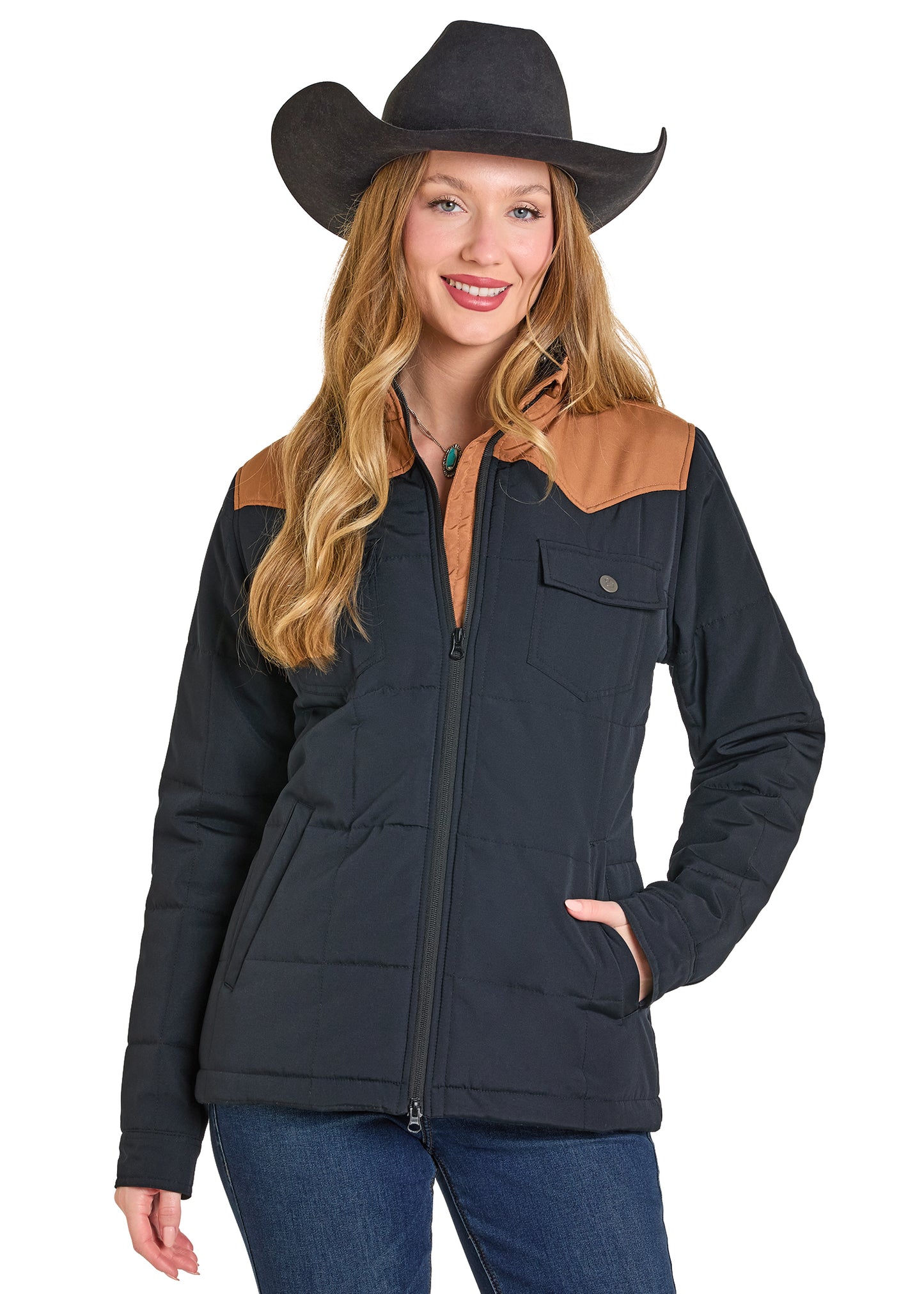 Woman wearing a black jacket with brown accents and a cowboy hat on a white background
