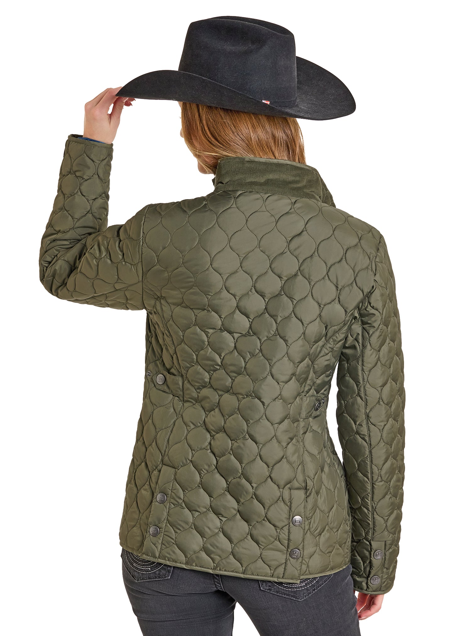 Person wearing a green quilted jacket and black cowboy hat on a white background