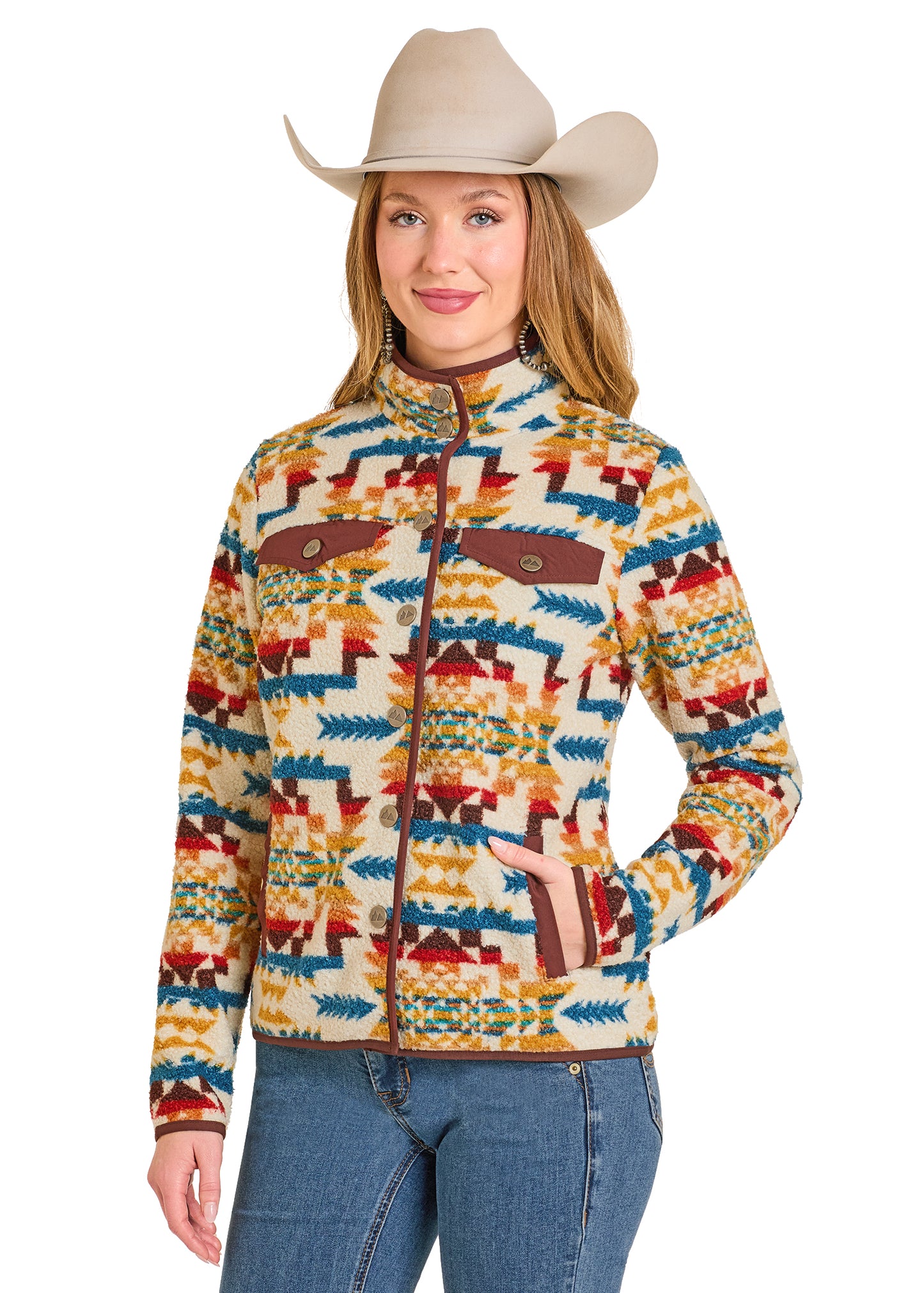 Woman wearing a colorful patterned jacket and cowboy hat on a white background