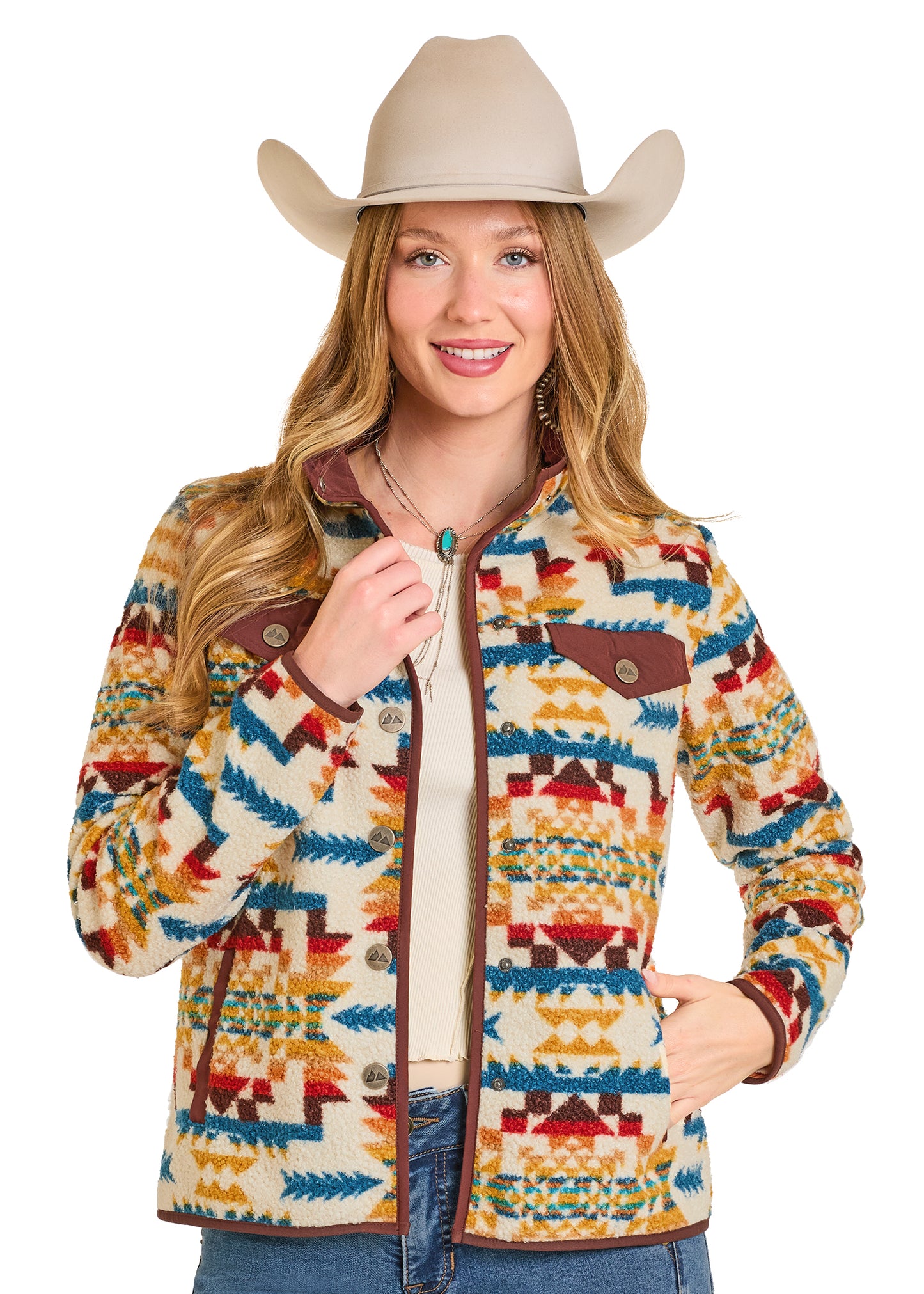 Woman wearing a colorful patterned jacket and cowboy hat on a white background