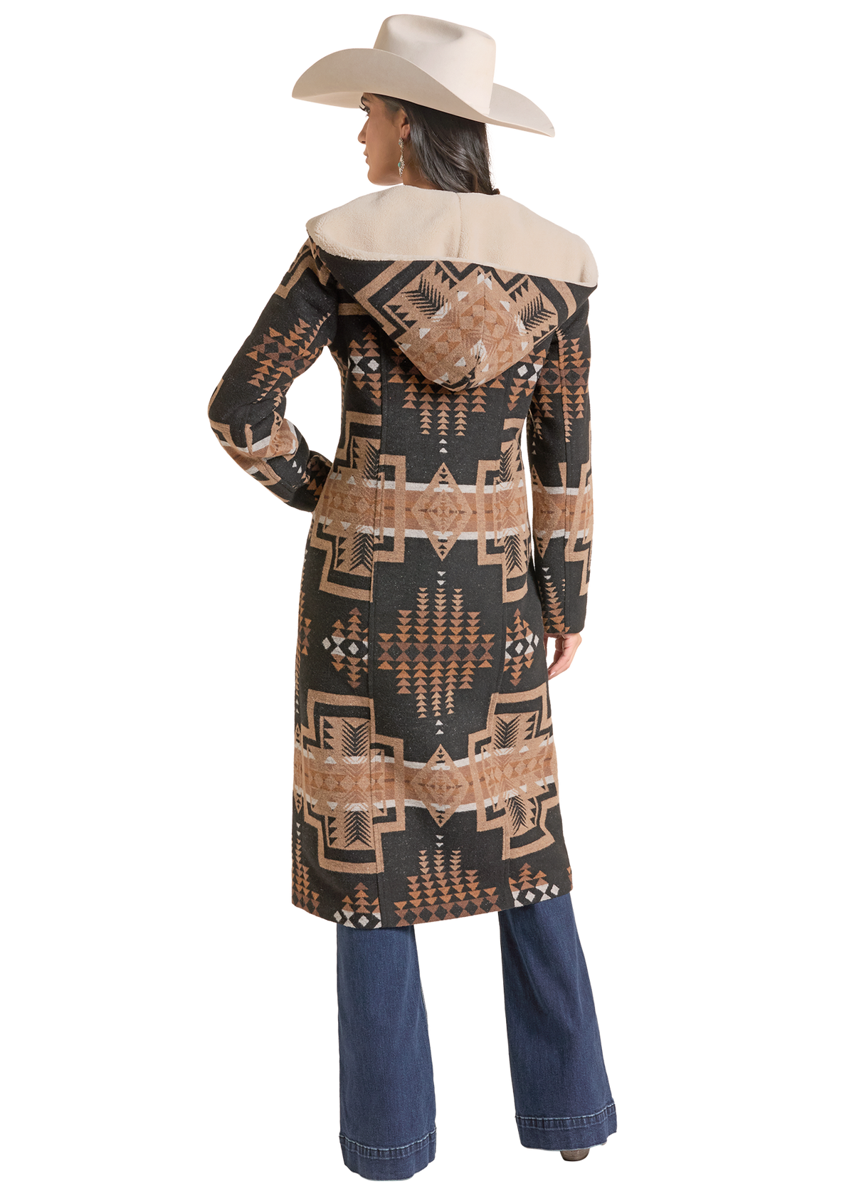 A woman shown from the back wearing a long hooded coat with a Southwestern-style geometric pattern in black.