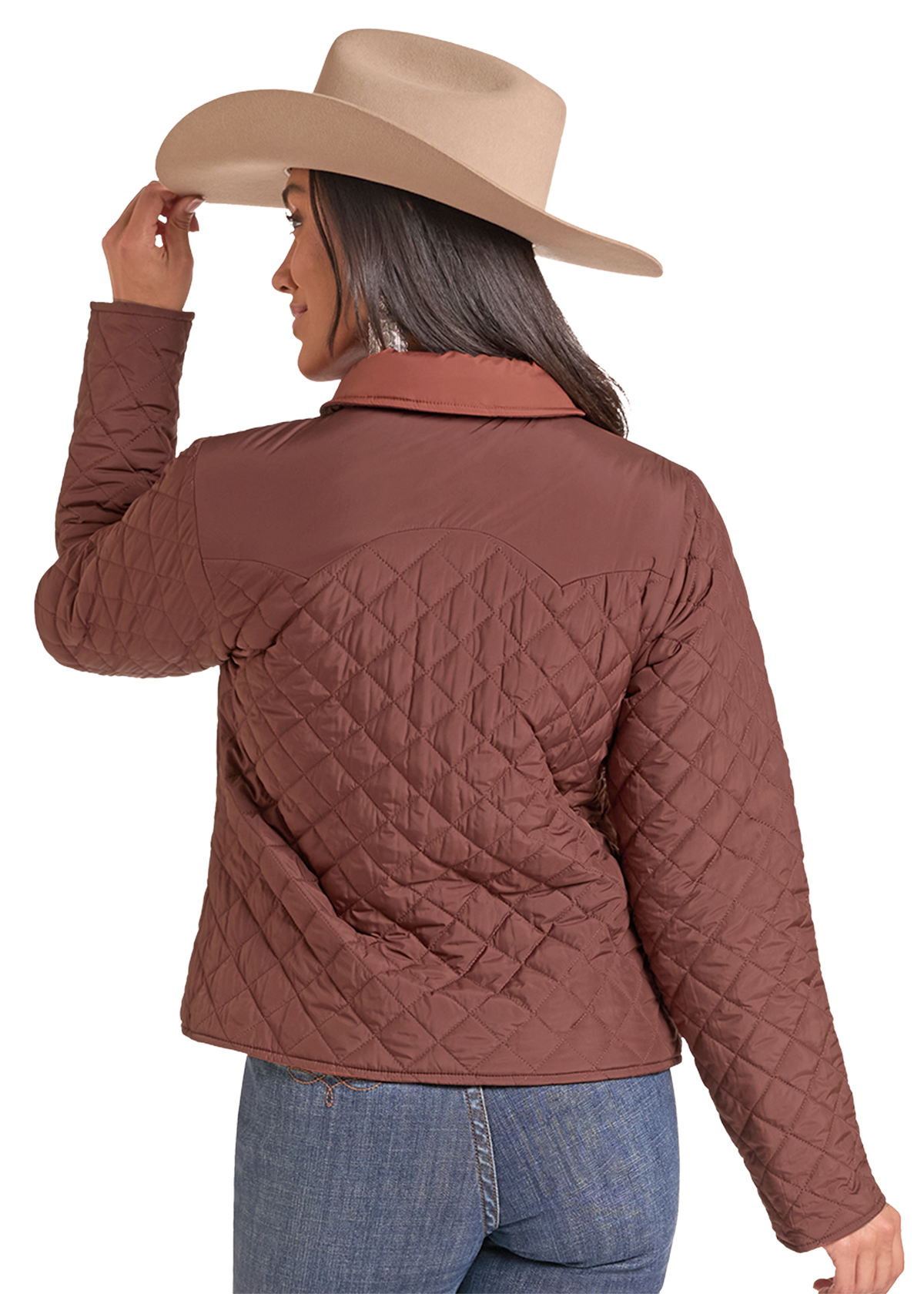 The back of a woman wearing a brown diamond-quilted zip-up jacket with a contrasting tan collar, a tan cowboy hat, and blue jeans.