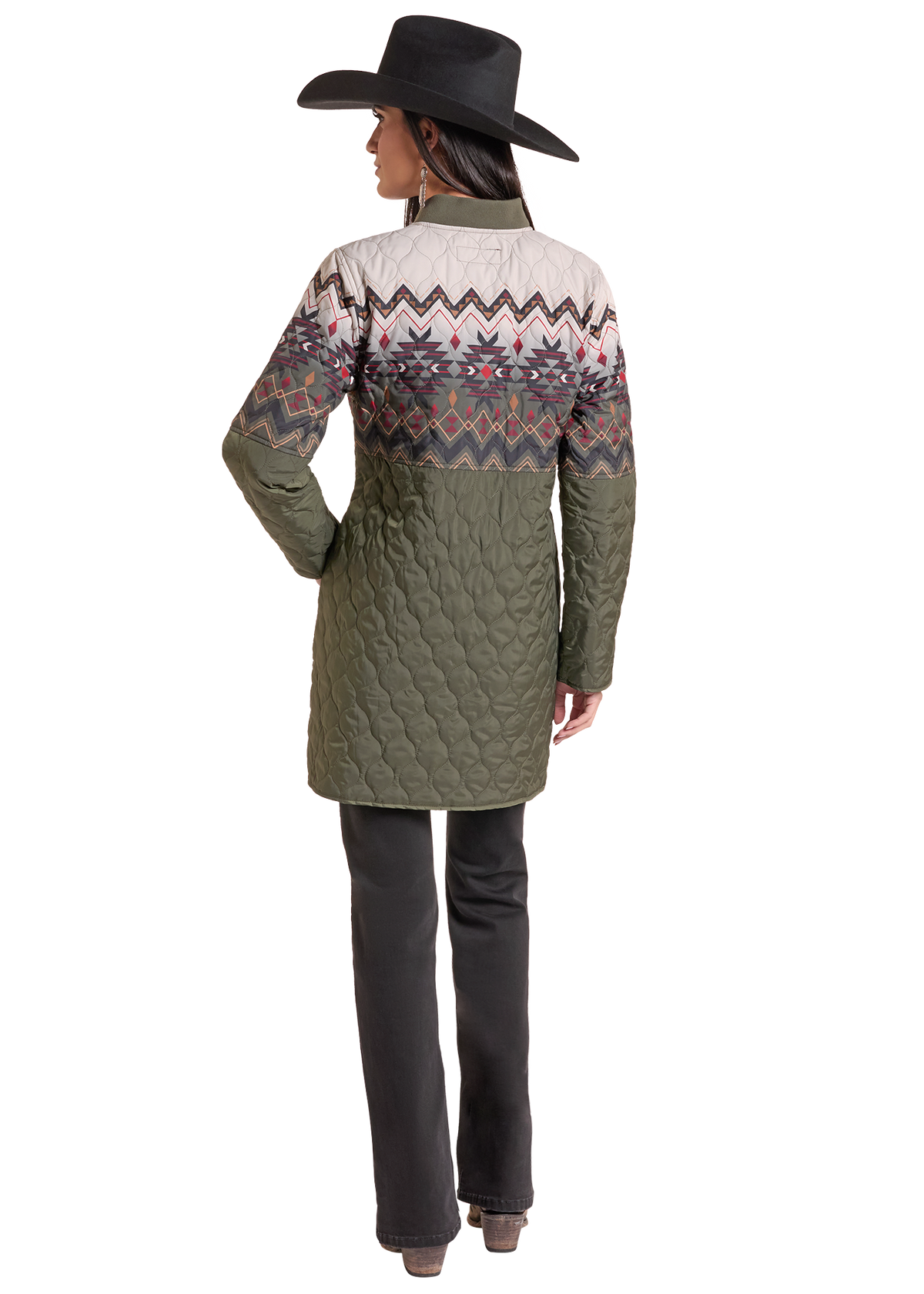 The back of a Women wearing a quilted Aztec jacket that hits at the mid thigh. 