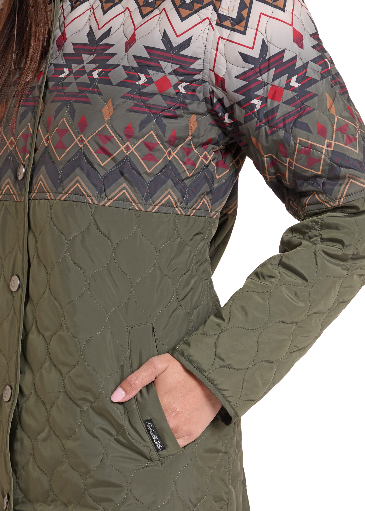 Close up of a women's quilted Aztec jacket. 