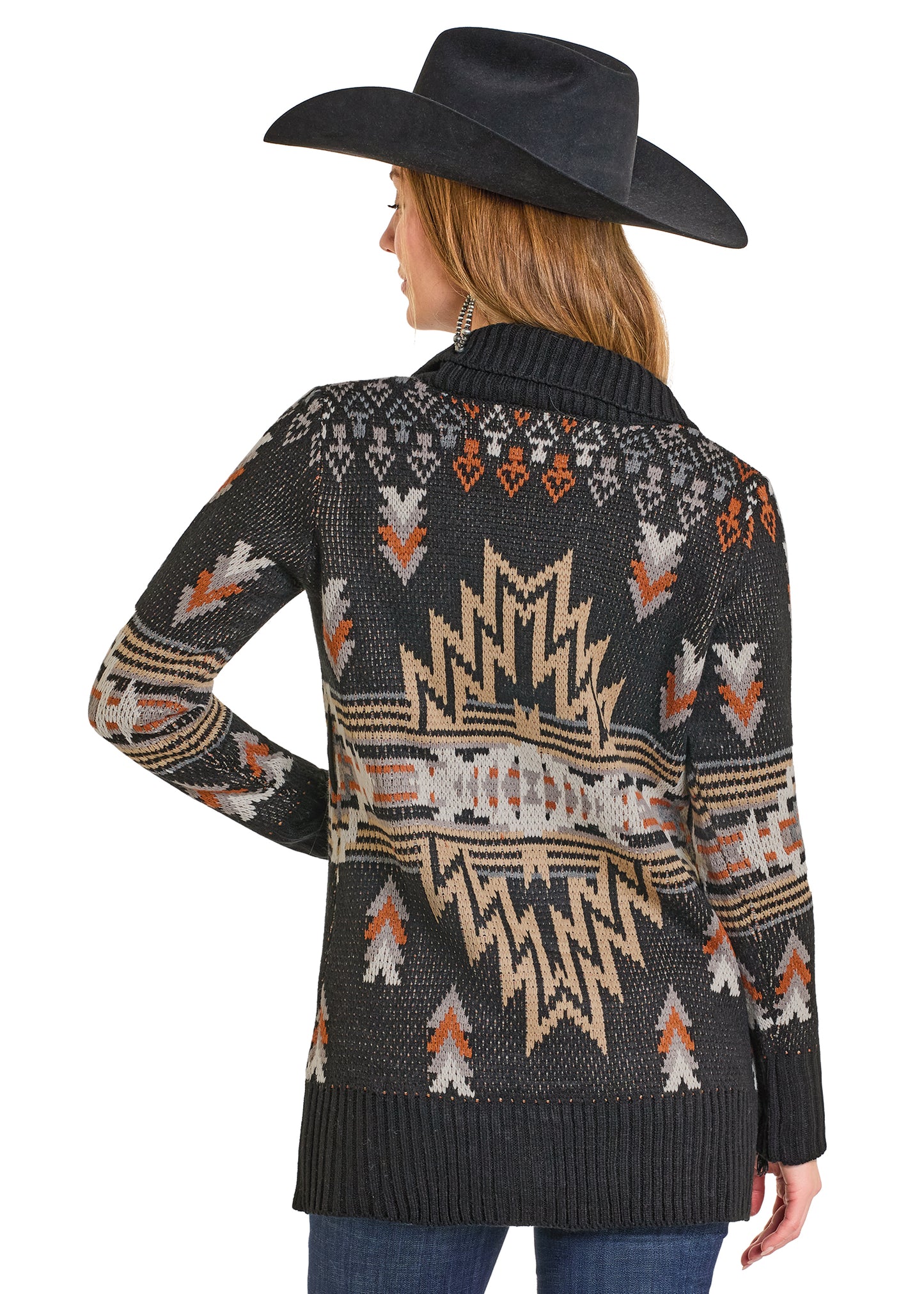 Woman wearing a patterned sweater and cowboy hat on a white background