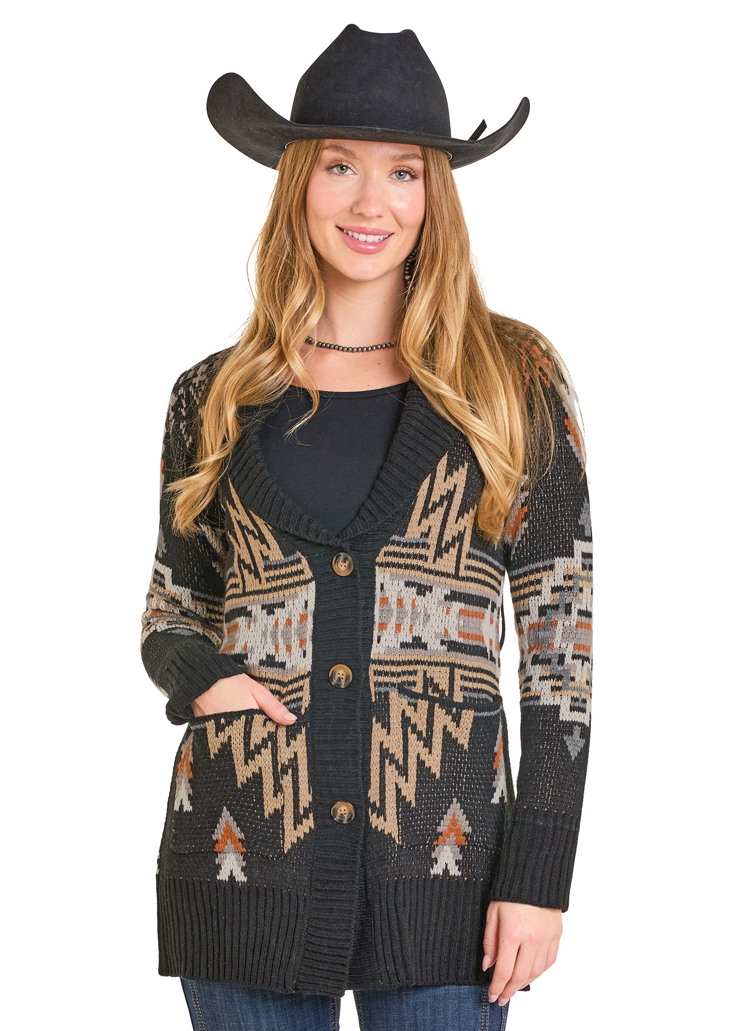 Woman wearing a patterned cardigan and cowboy hat on a white background