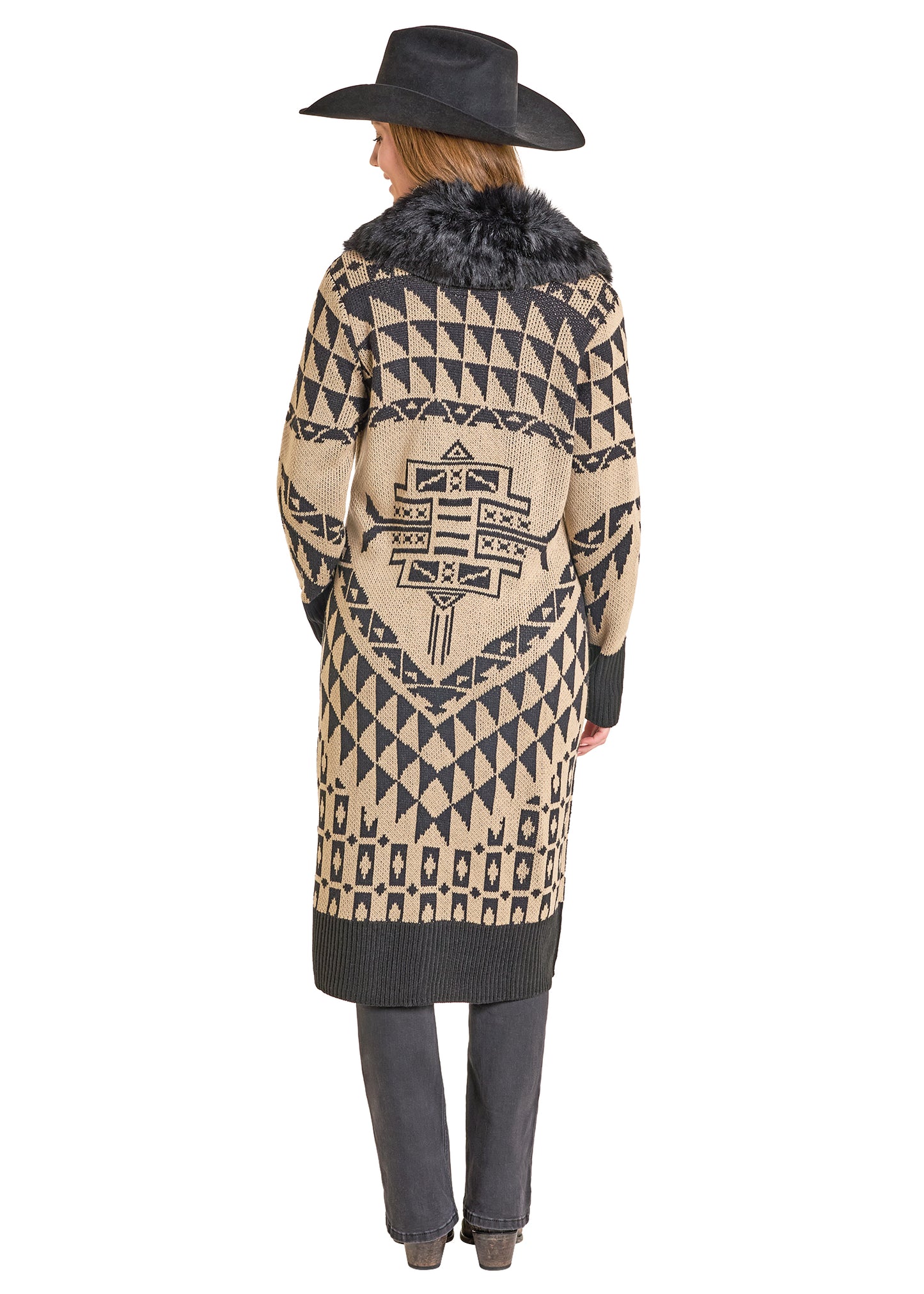 Person wearing a patterned coat with a fur-lined hood on a white background