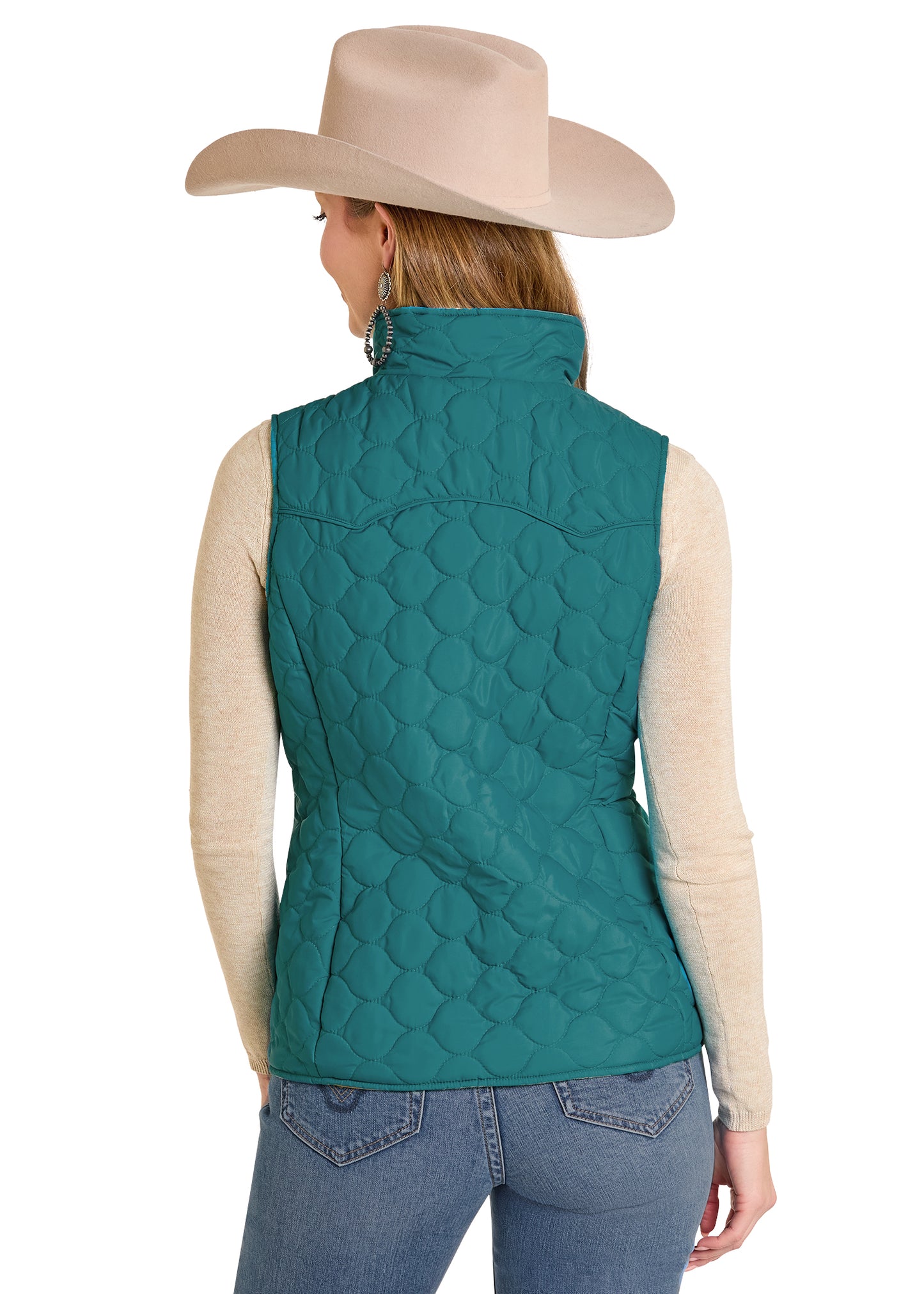 Person wearing a teal quilted vest with a beige cowboy hat on a white background
