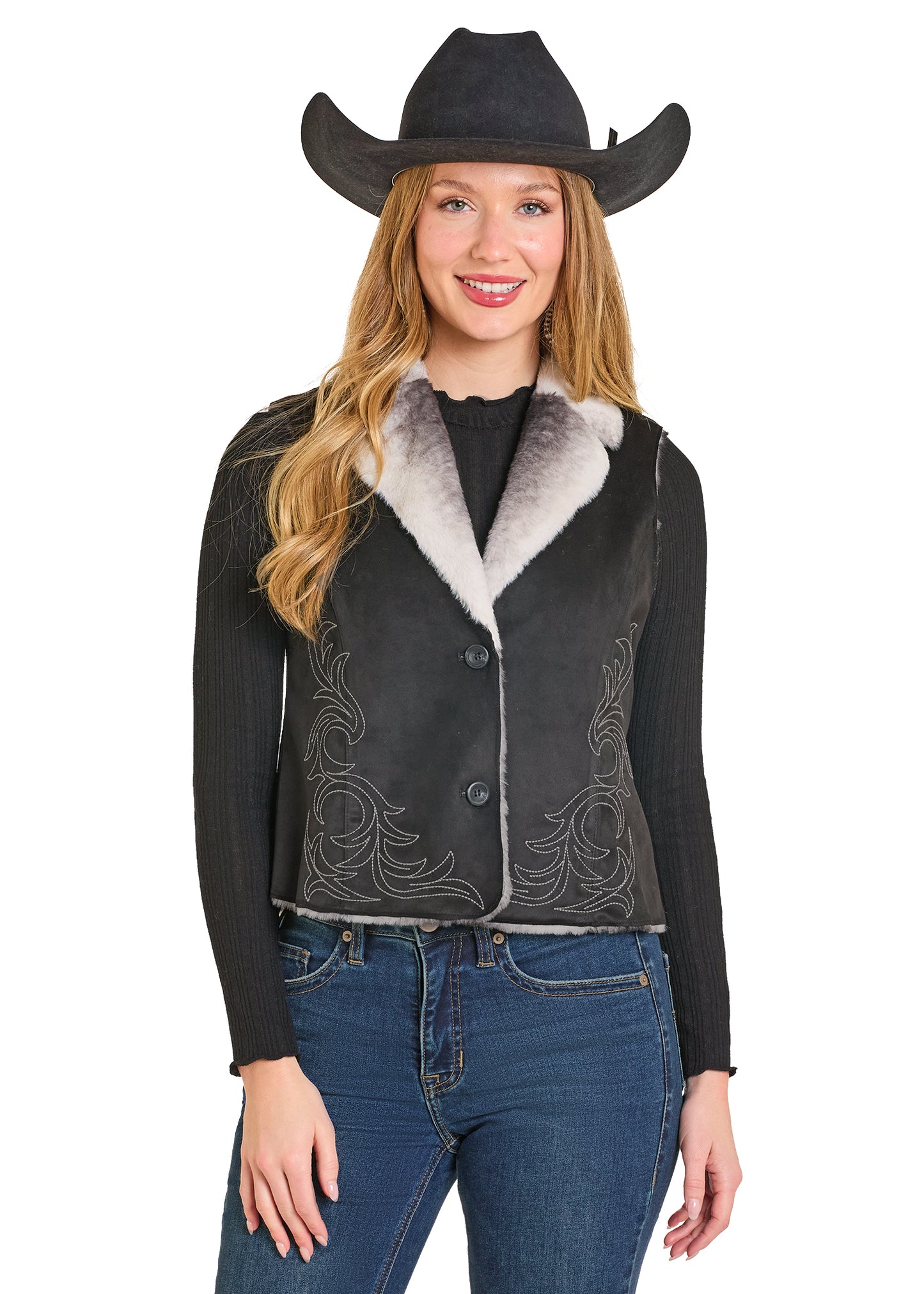 Woman wearing a black leather jacket with white fur lining and a cowboy hat on a white background