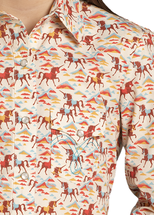 Child wearing a cowboy hat and patterned shirt on a white background